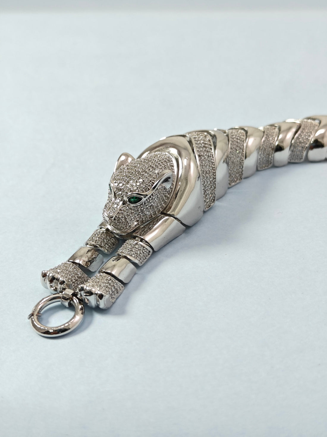 Silver panther bracelet on a light gray background