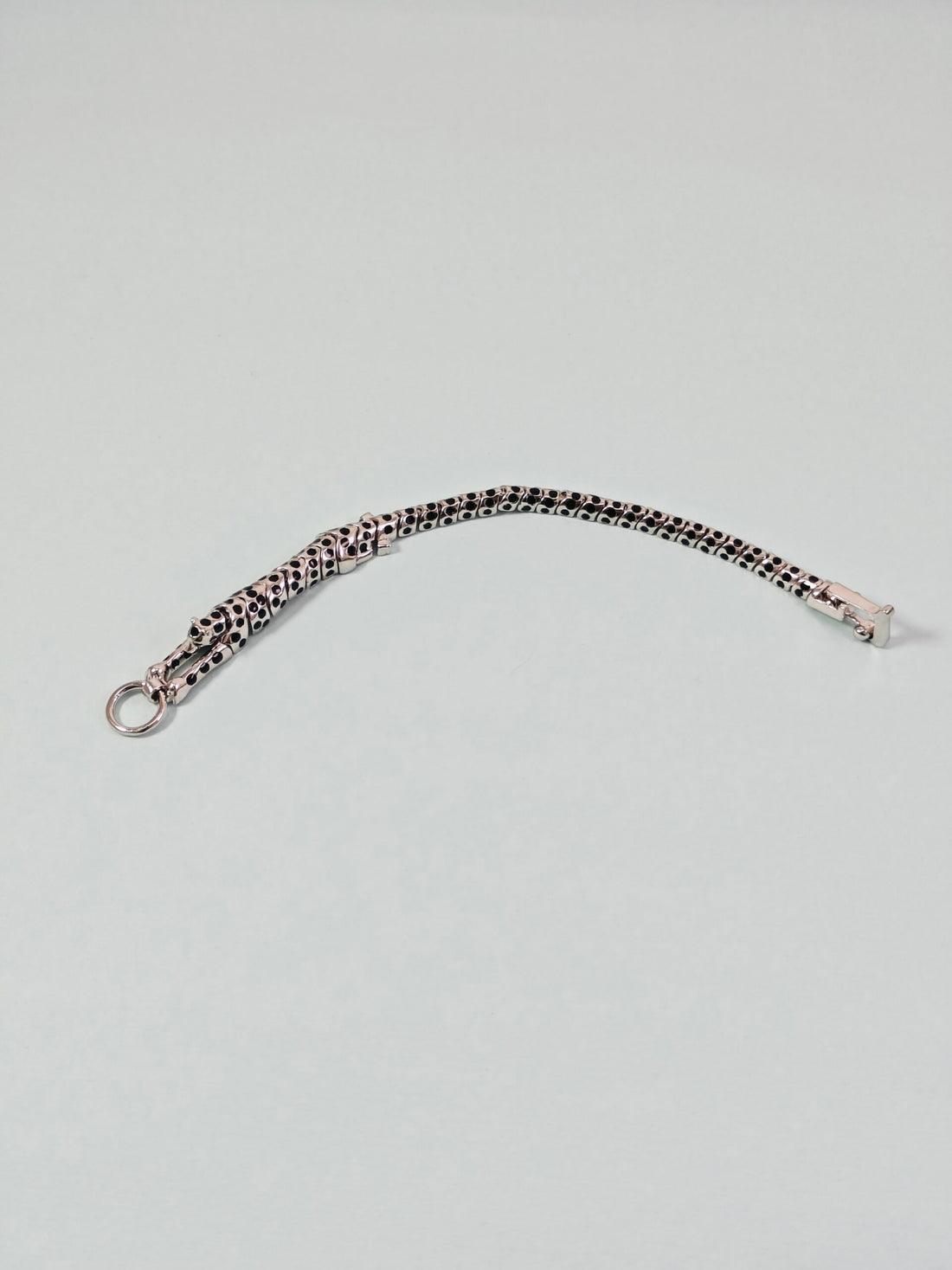 Bracelet with leopard print pattern on a light gray background