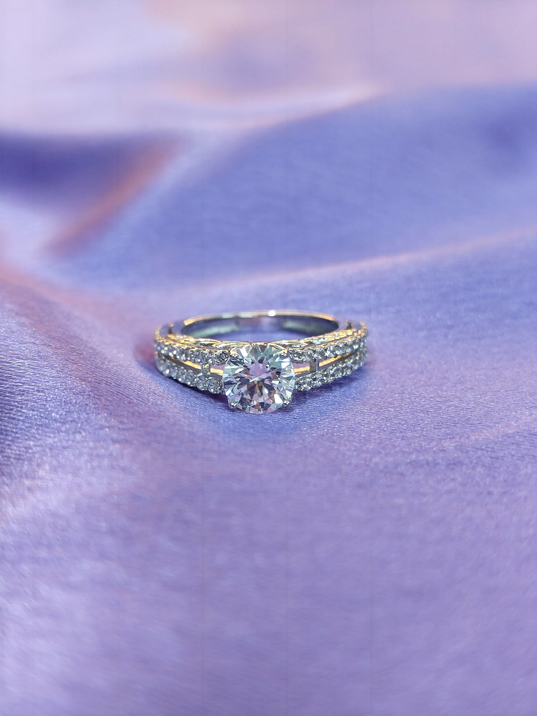 Diamond ring on a purple fabric background