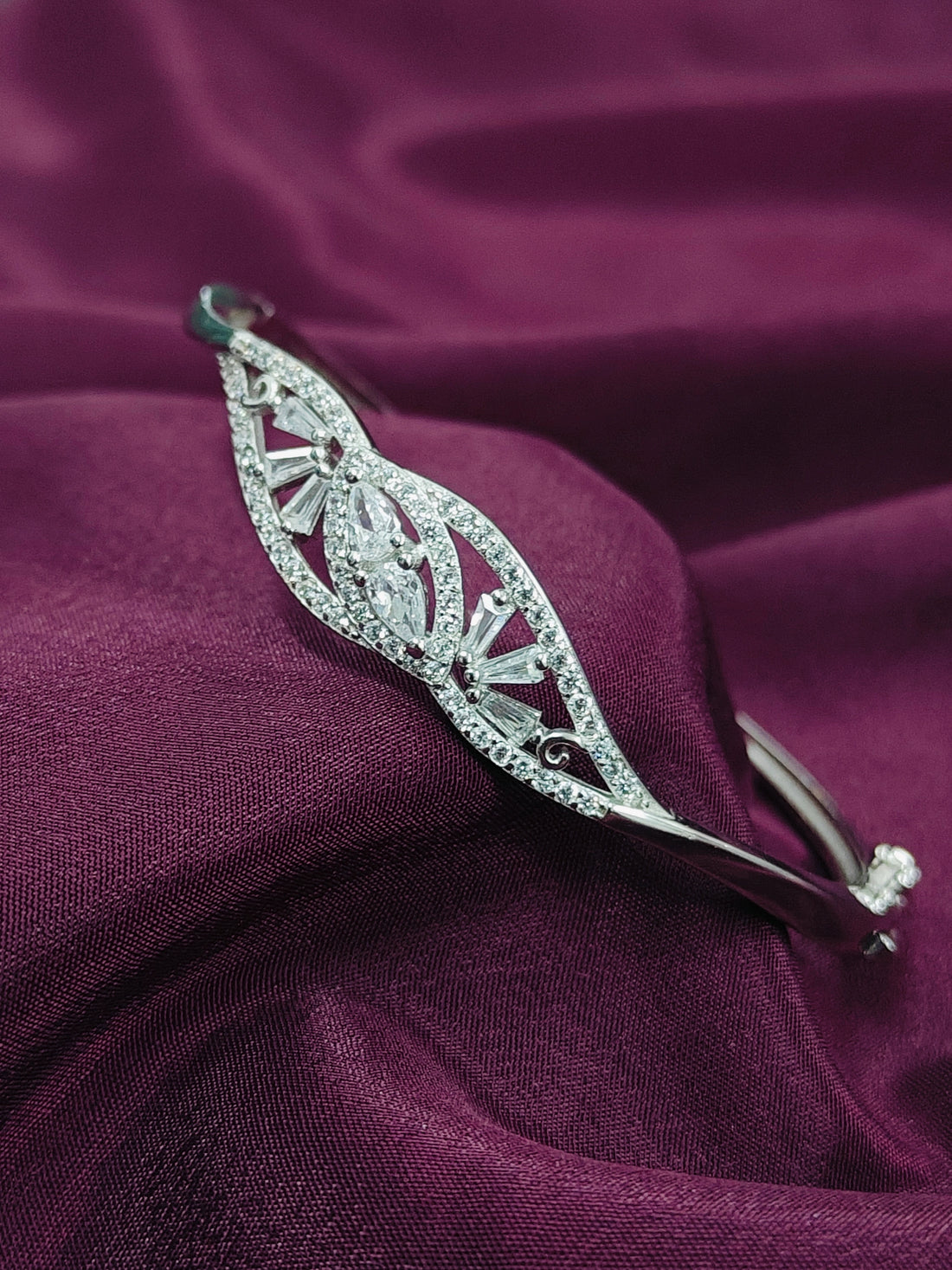 Silver tiara on a purple fabric background