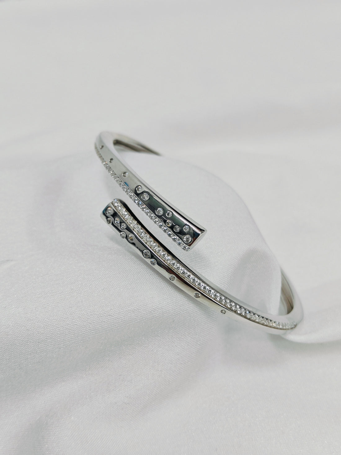 Silver bracelet with gemstones on a white background