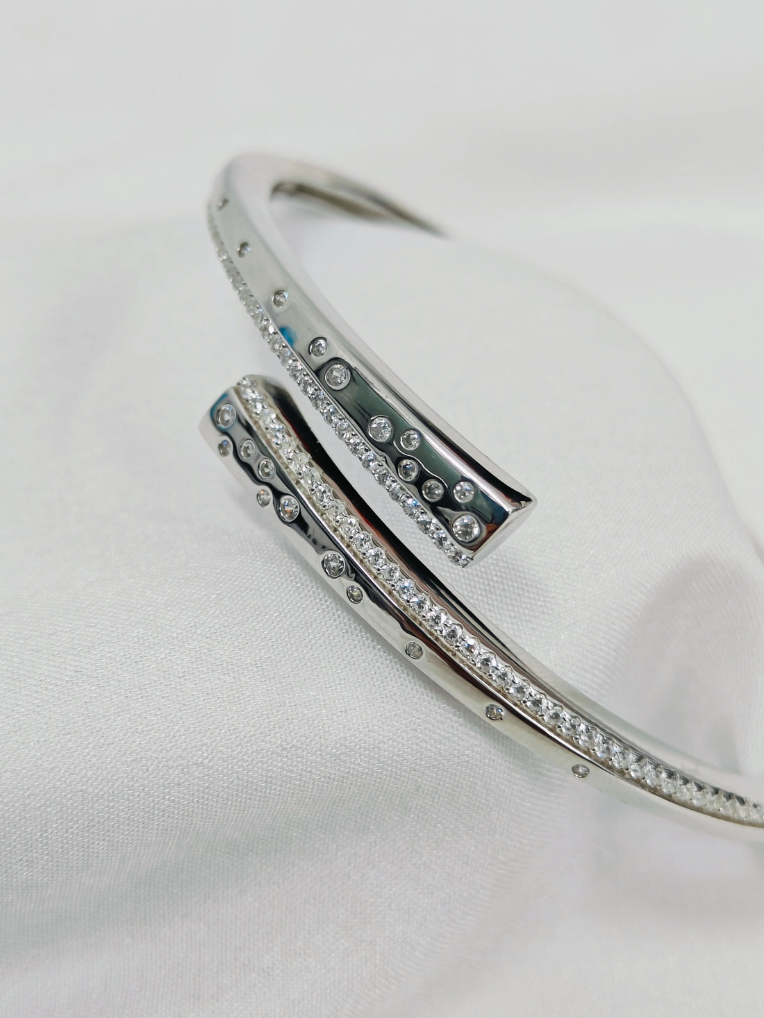 Silver bracelet with gemstones on a white background