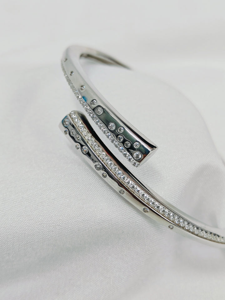 Silver bracelet with gemstones on a white background