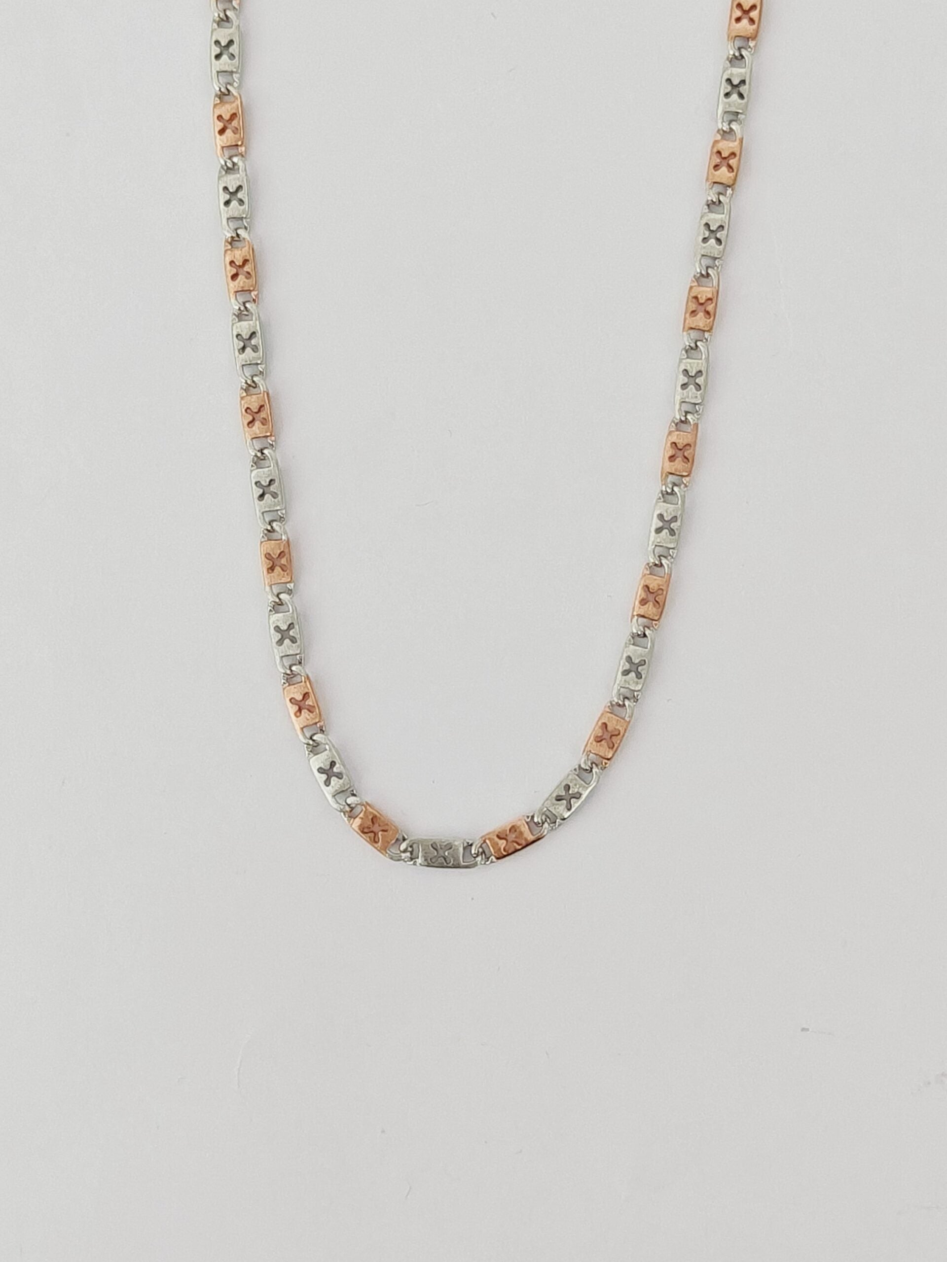 Necklace with multicolored beads on a light gray background