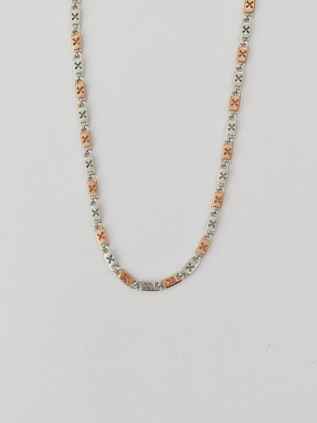 Necklace with multicolored beads on a light gray background