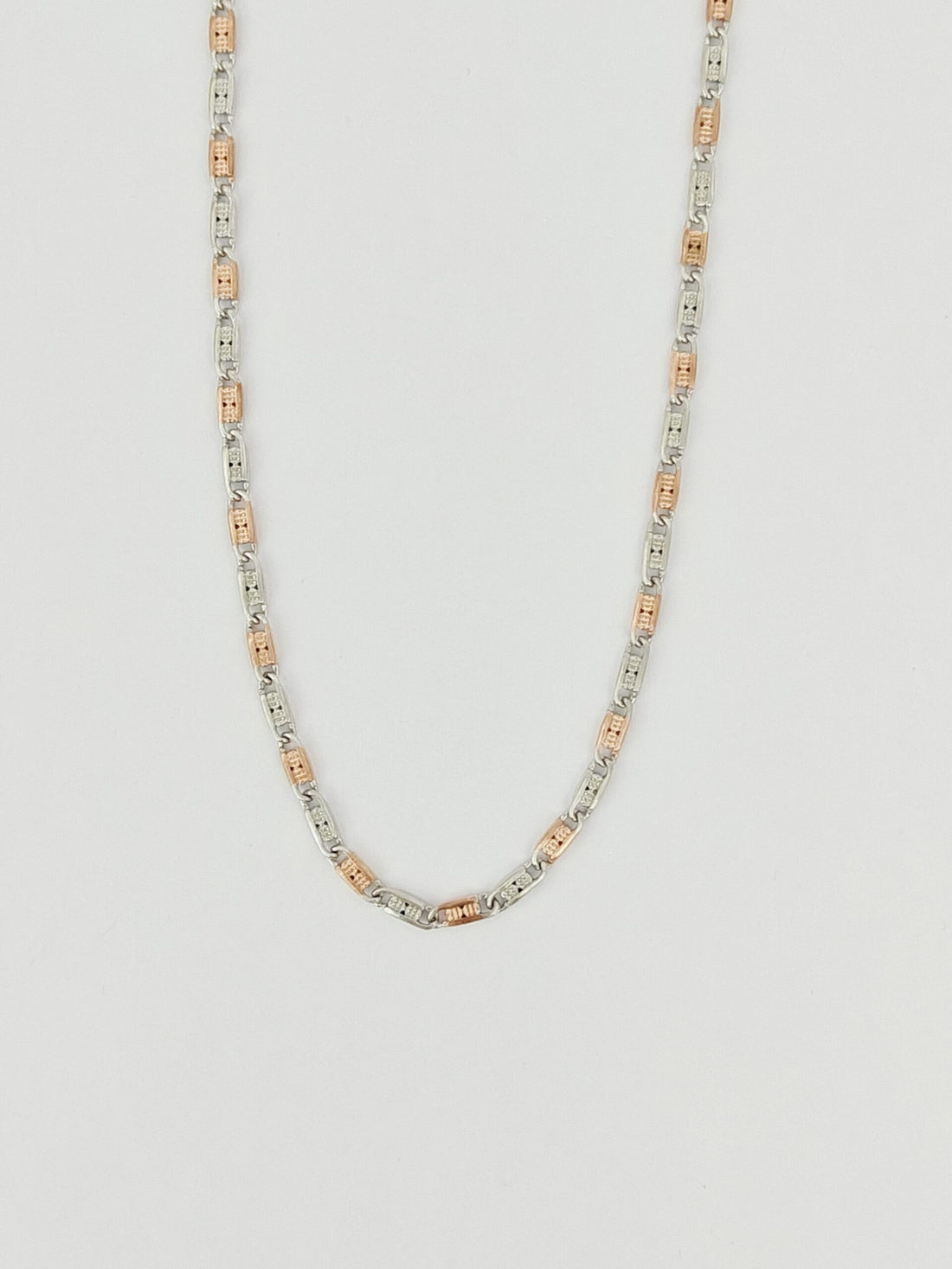Necklace with multicolored beads on a light gray background