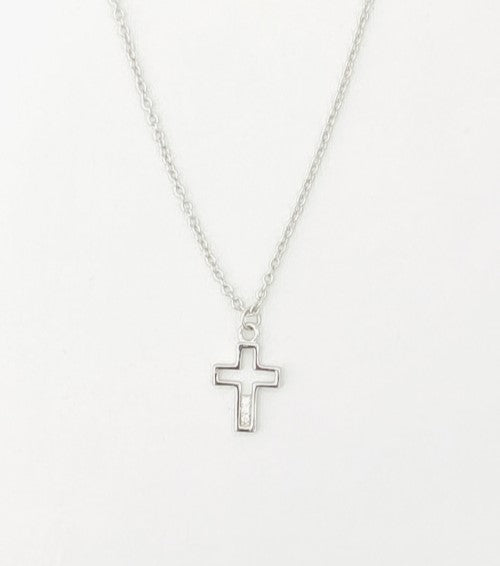Silver cross necklace on a white background