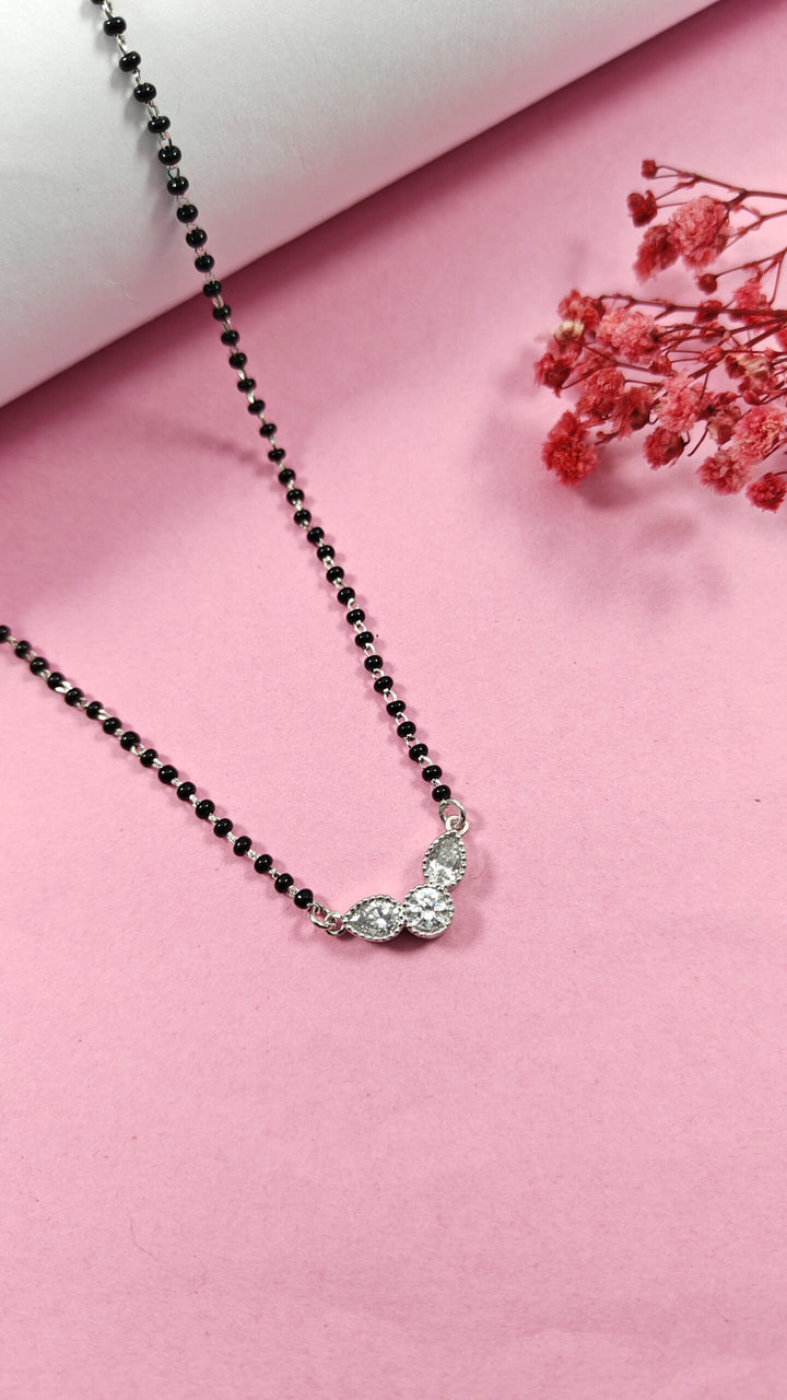 Necklace with a butterfly pendant on a pink background