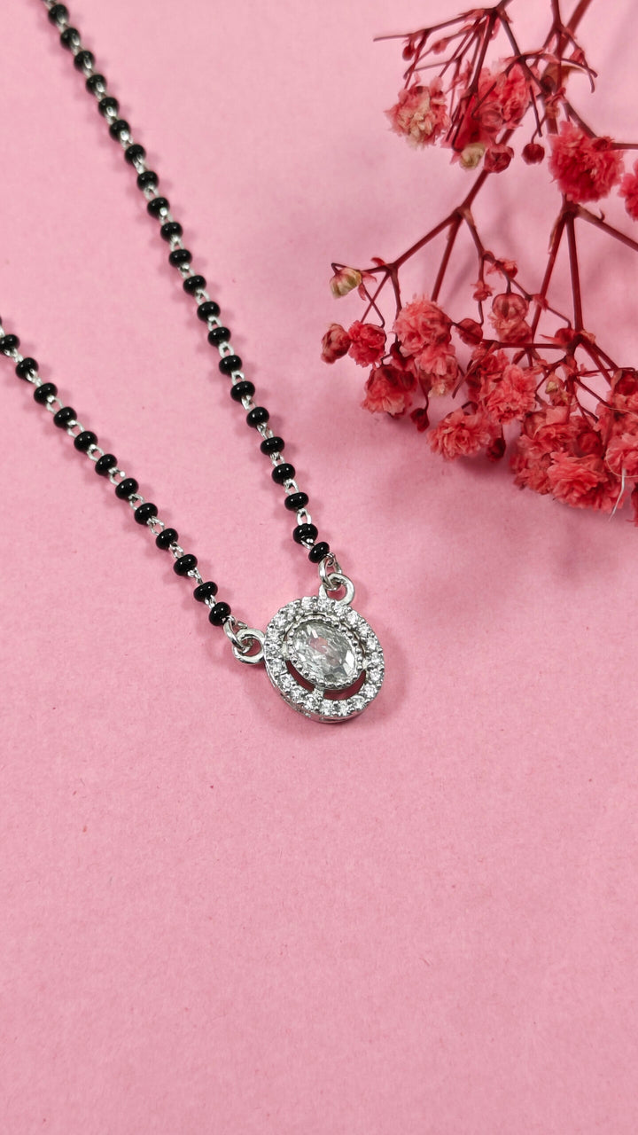 Necklace with a pendant on a pink background