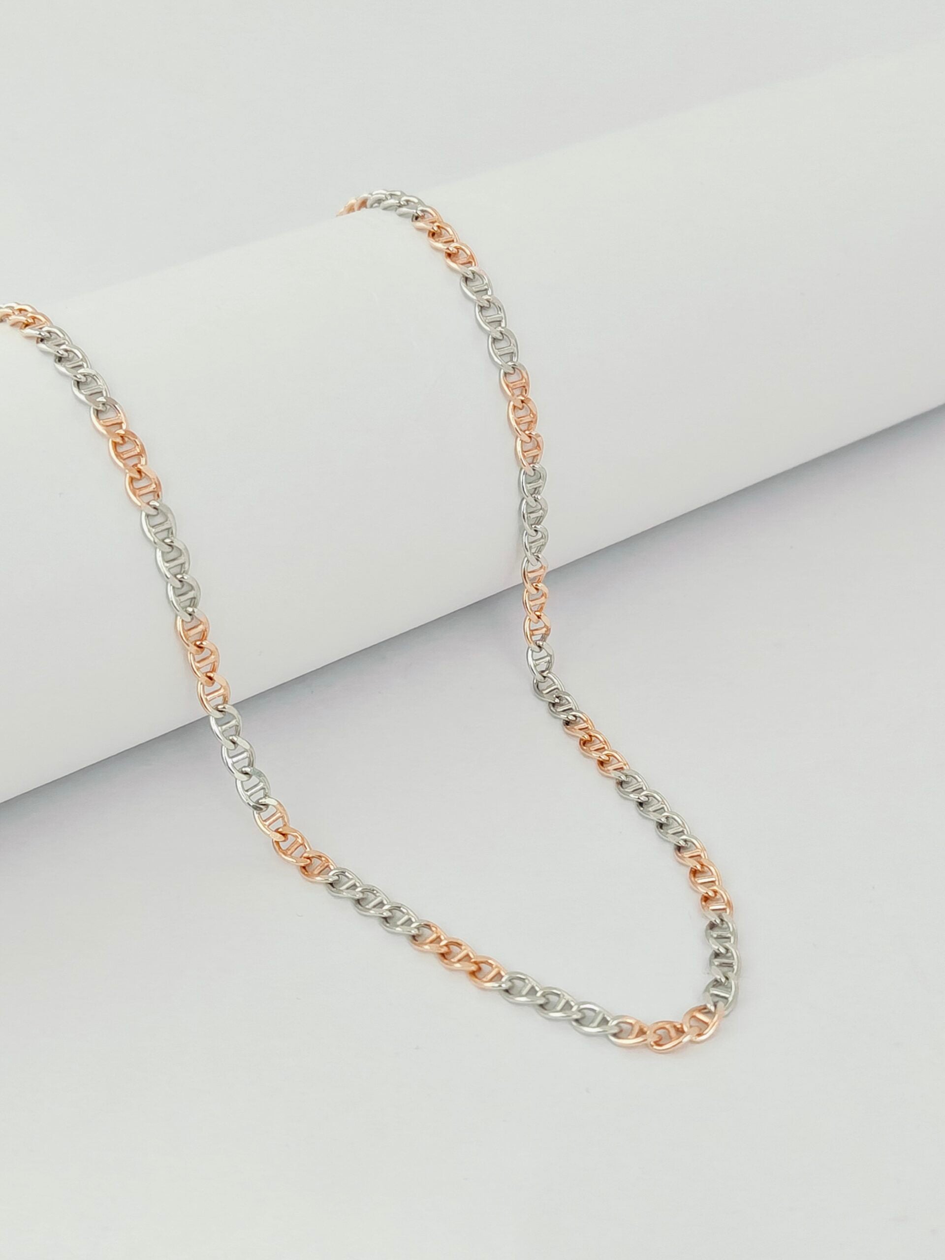 Two-tone necklace on a light gray background