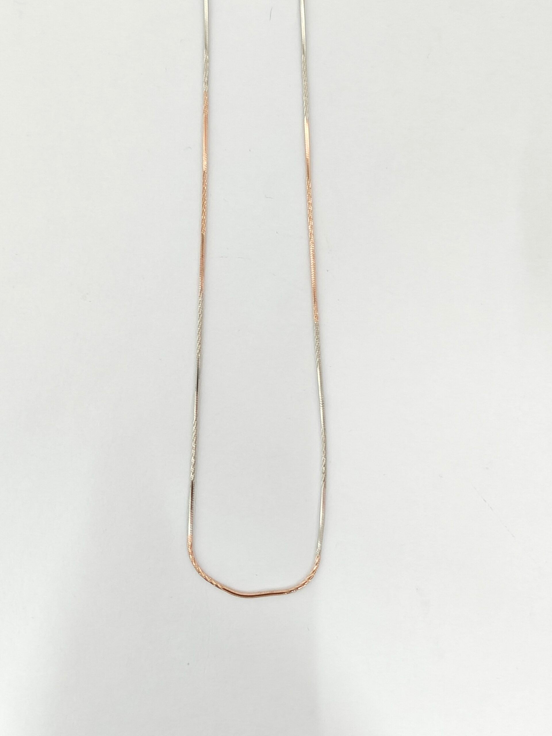 Gold necklace on a white background