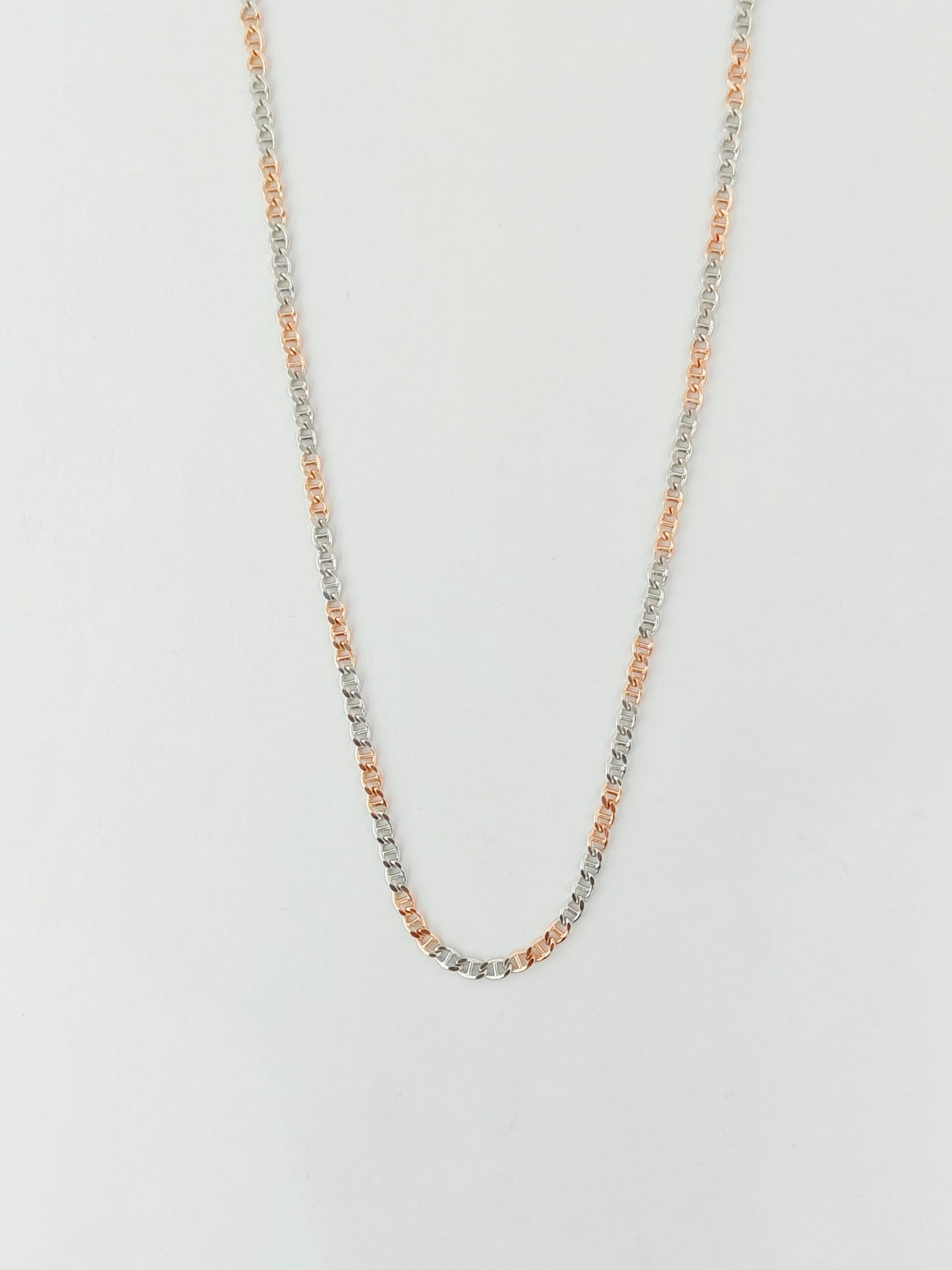 Necklace with small beads on a light gray background