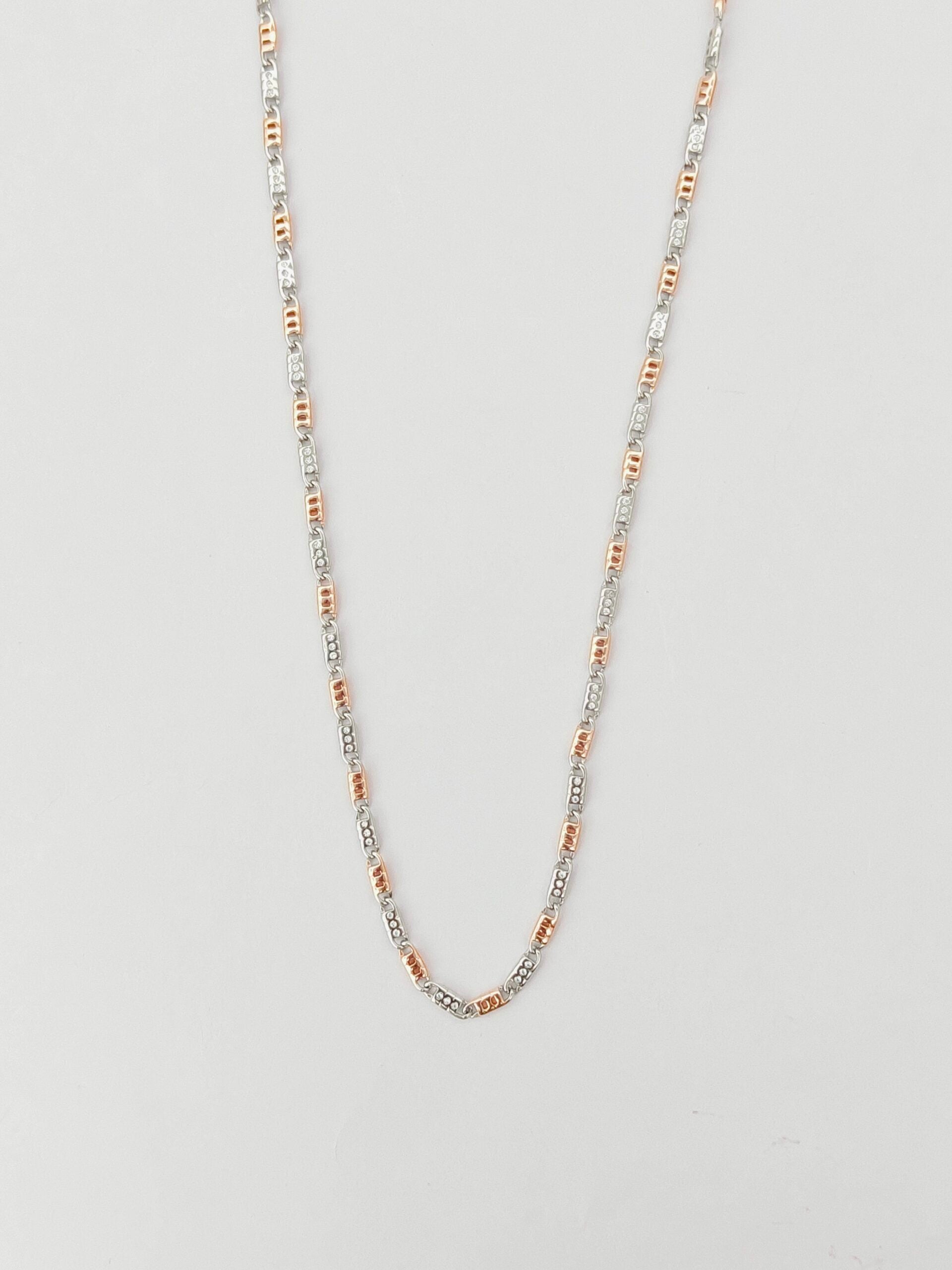 Necklace with multicolored beads on a light gray background