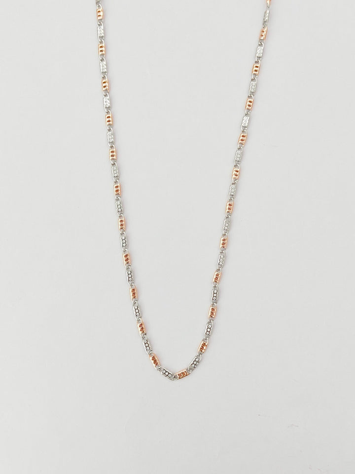 Necklace with multicolored beads on a light gray background