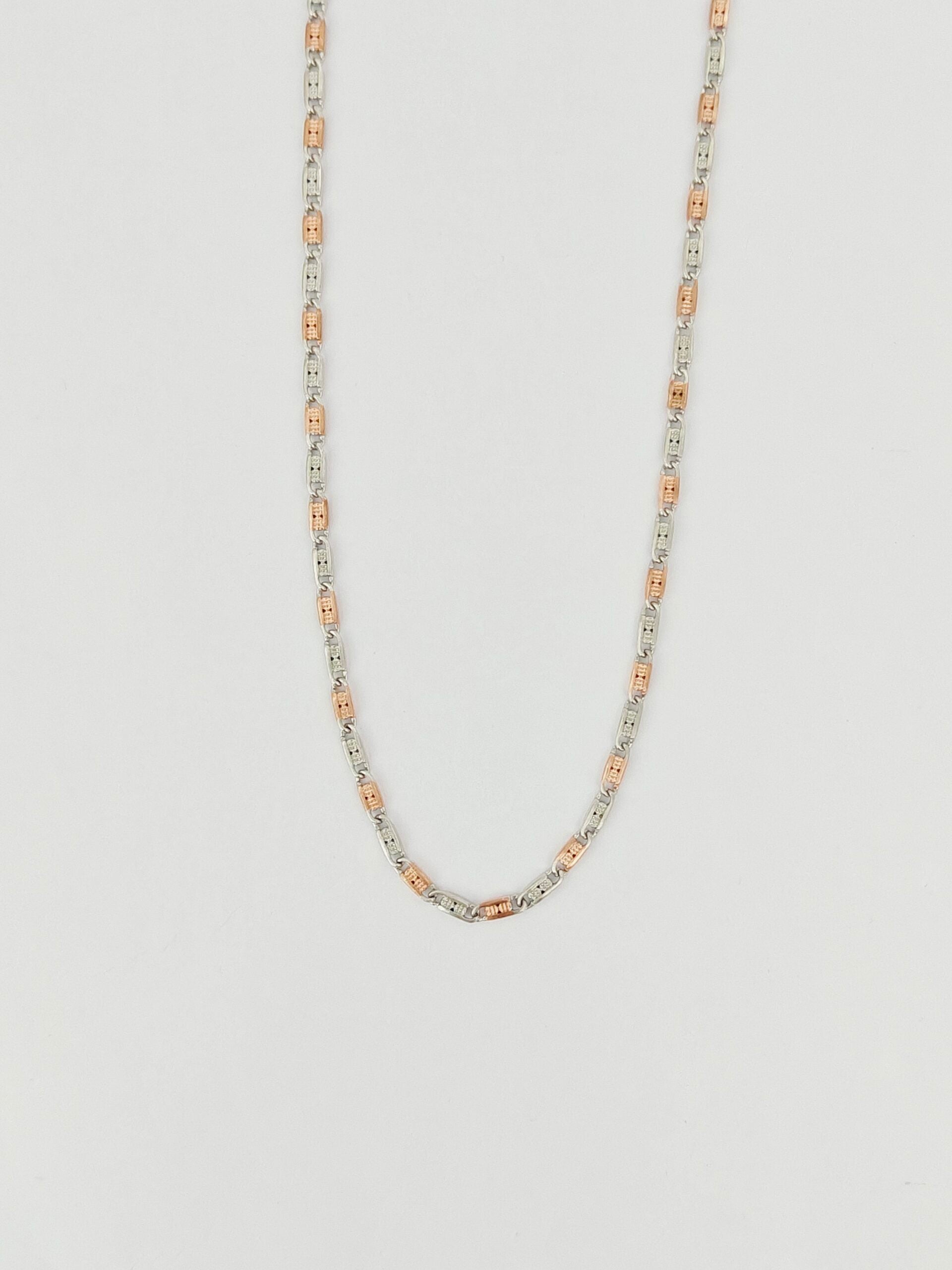 Necklace with alternating silver and rose gold beads on a light gray background