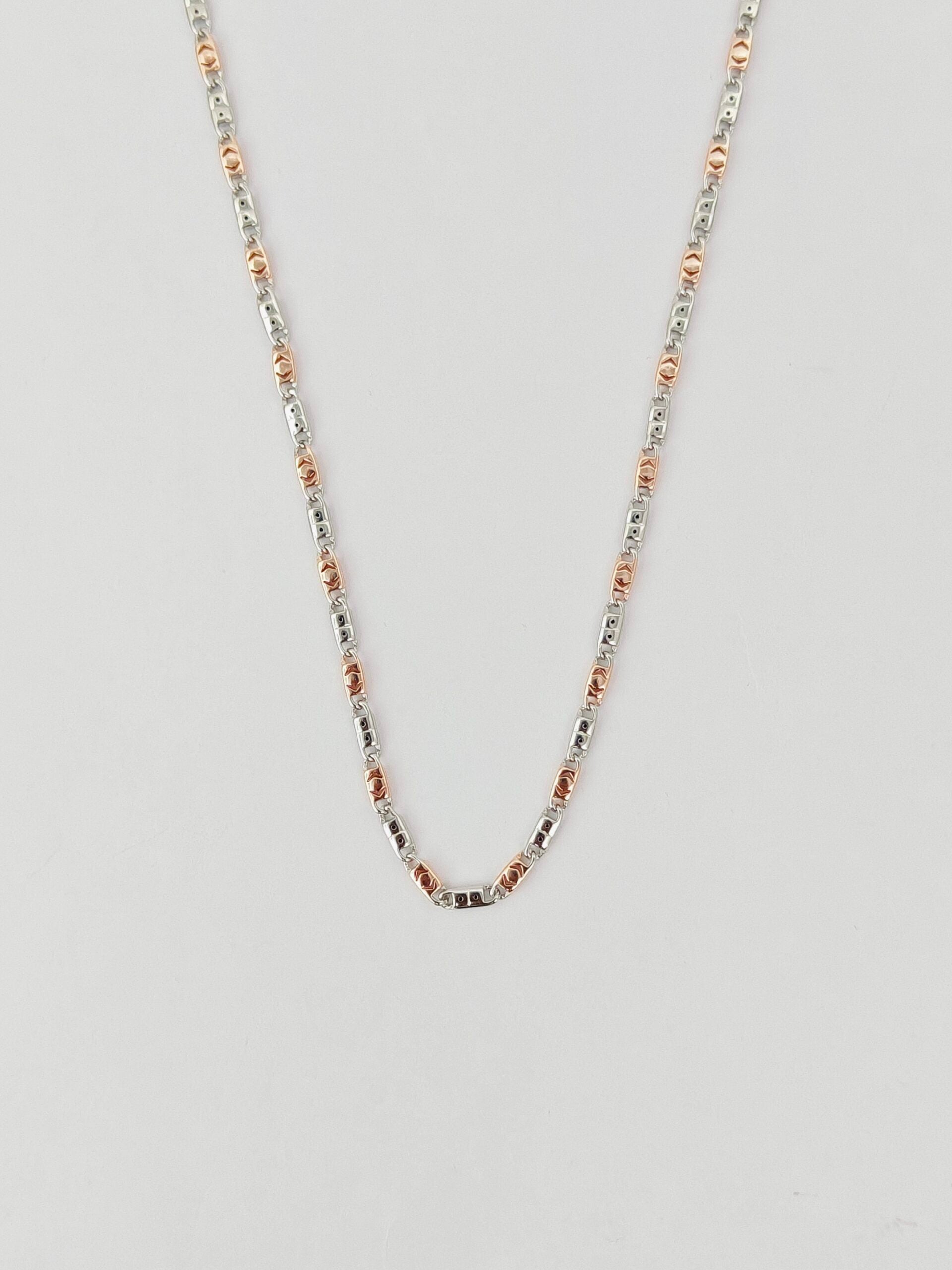 Necklace with small beads on a light gray background