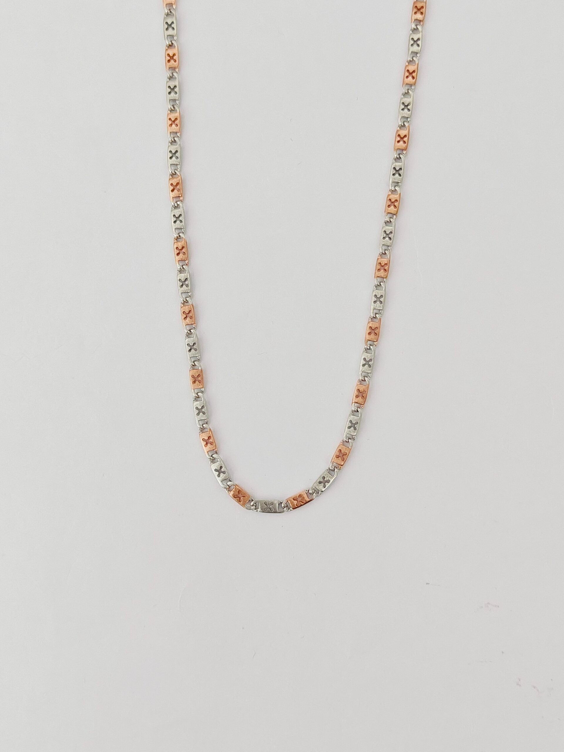 Necklace with small beads on a light gray background