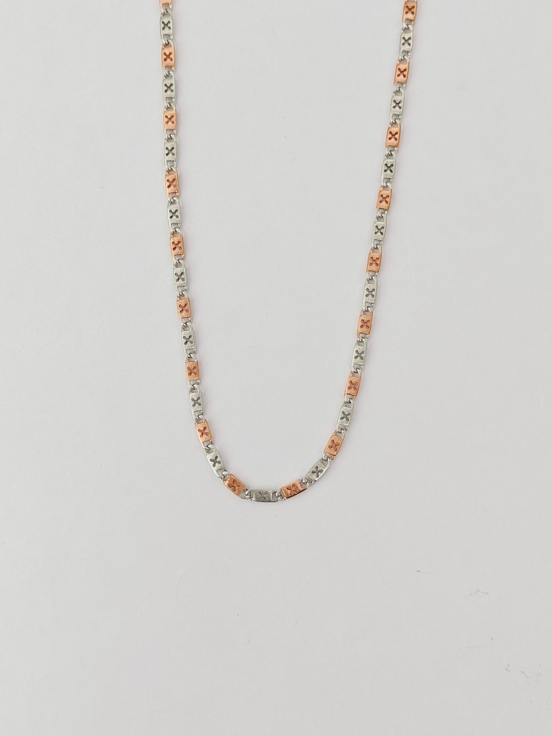 Necklace with small beads on a light gray background