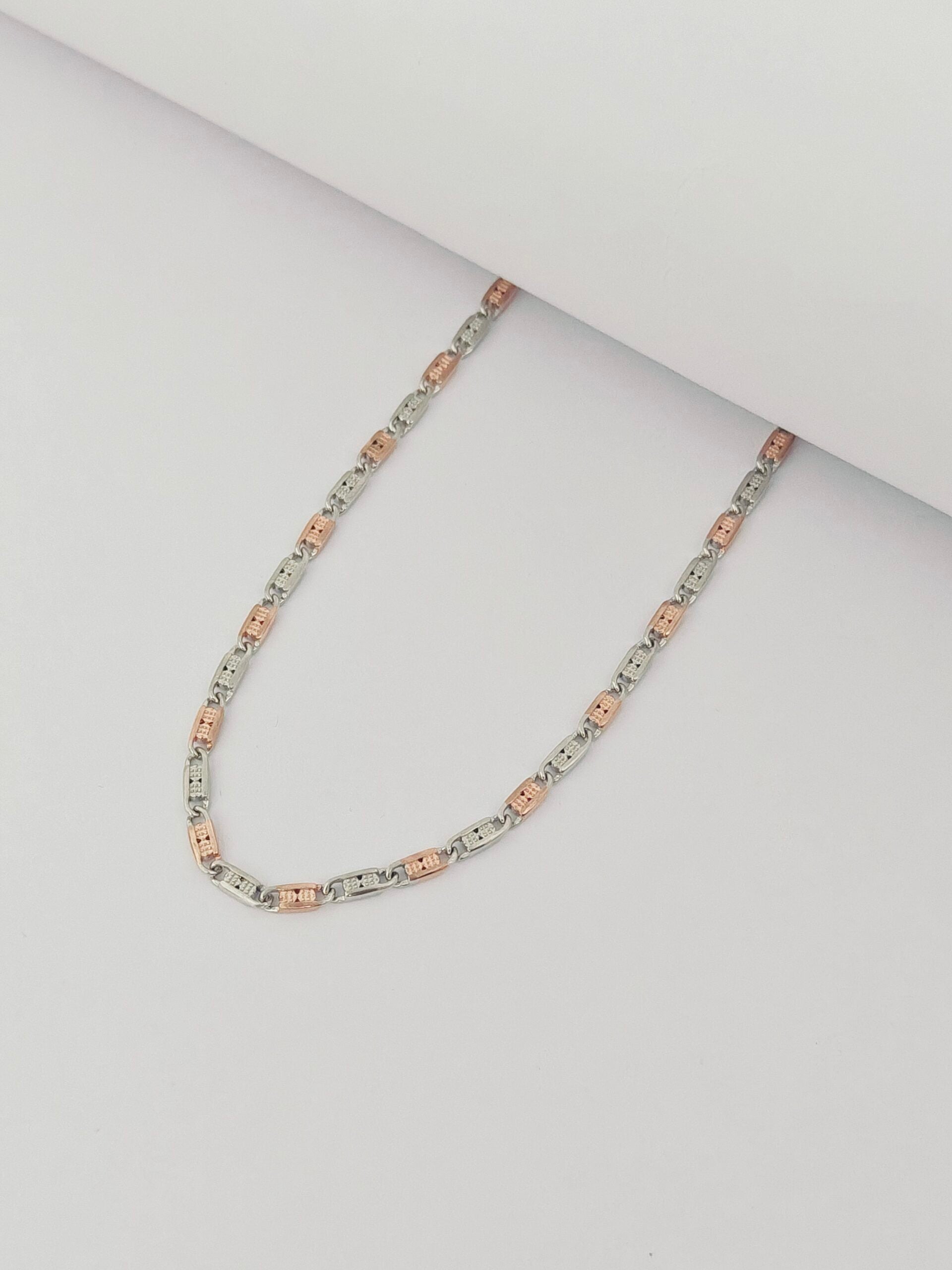 Necklace with pink and silver links on a light gray background