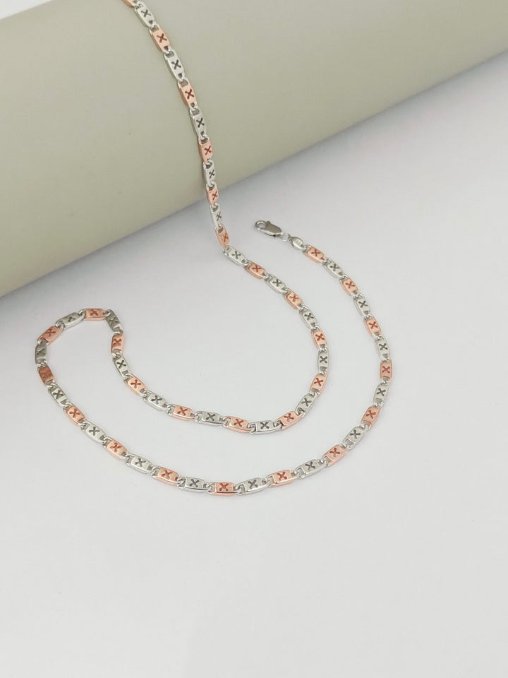 Multicolored chain necklace on a light gray surface