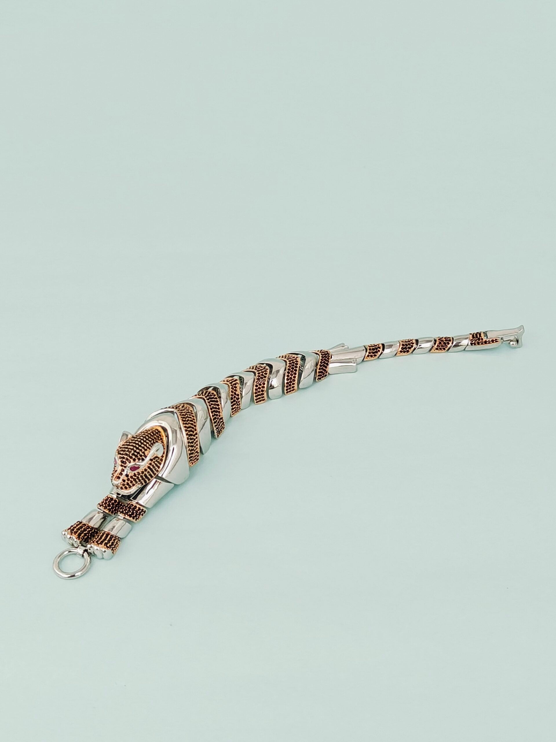 Bracelet with a patterned band on a light gray background