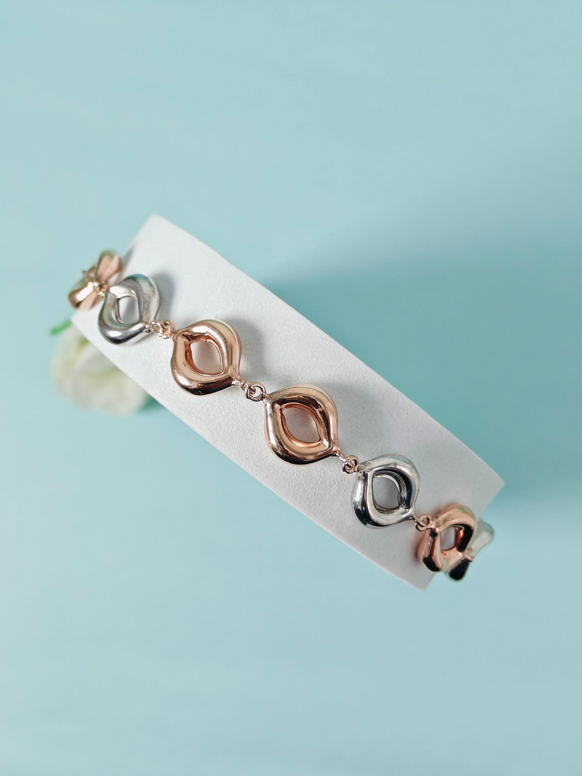 Set of earrings on a white card with a light blue background