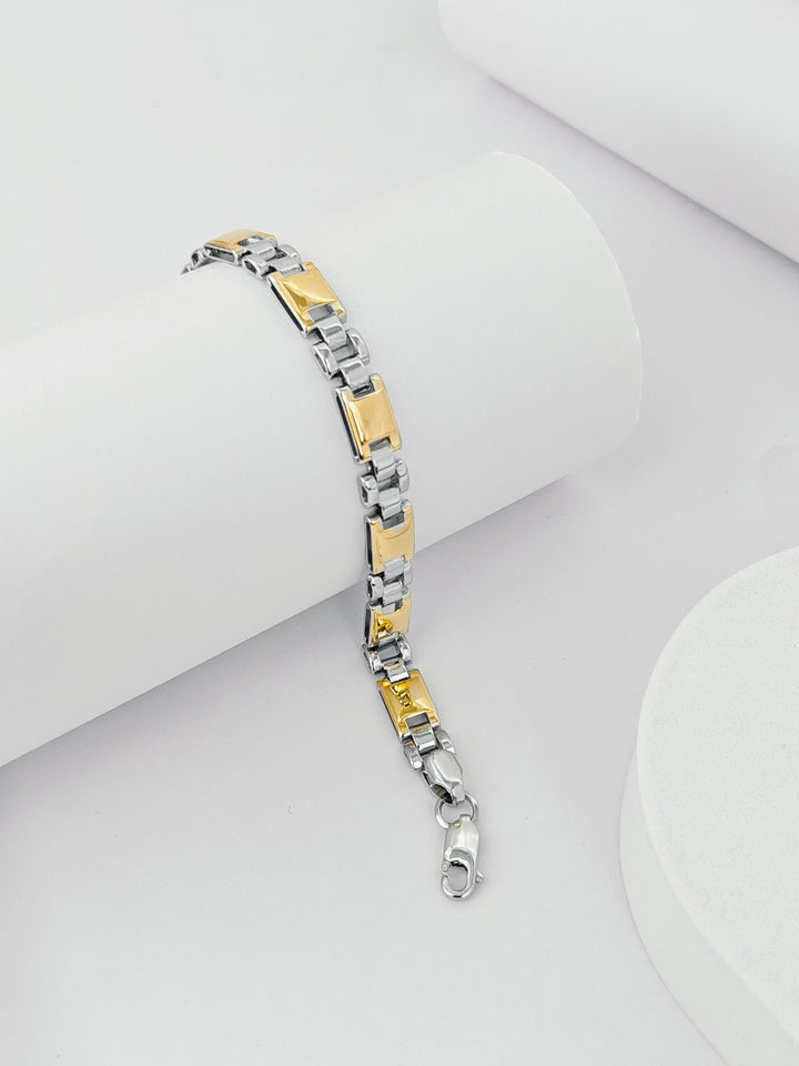 Two-tone bracelet on a white surface