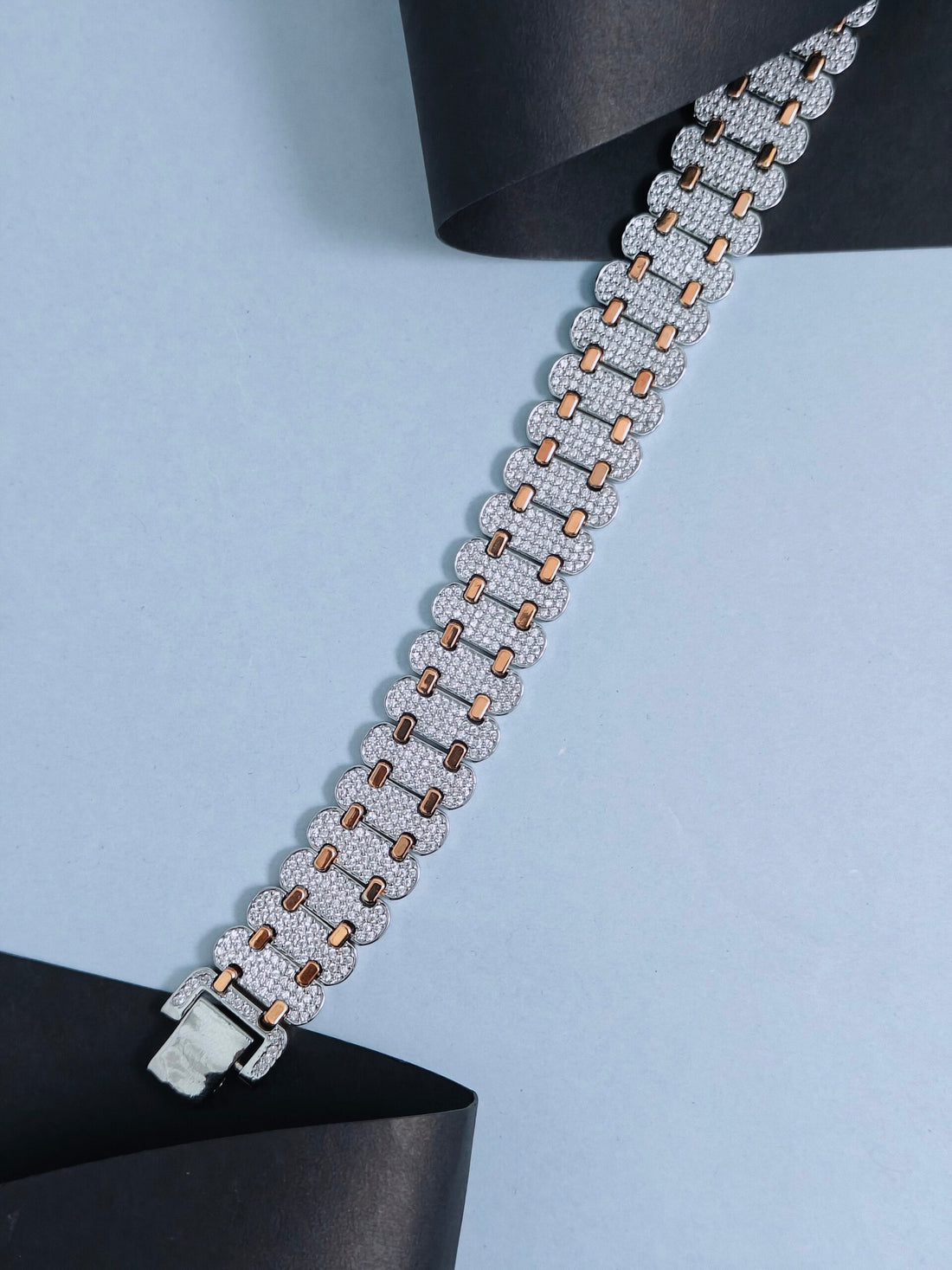 Bracelet with diamond accents on a light blue background