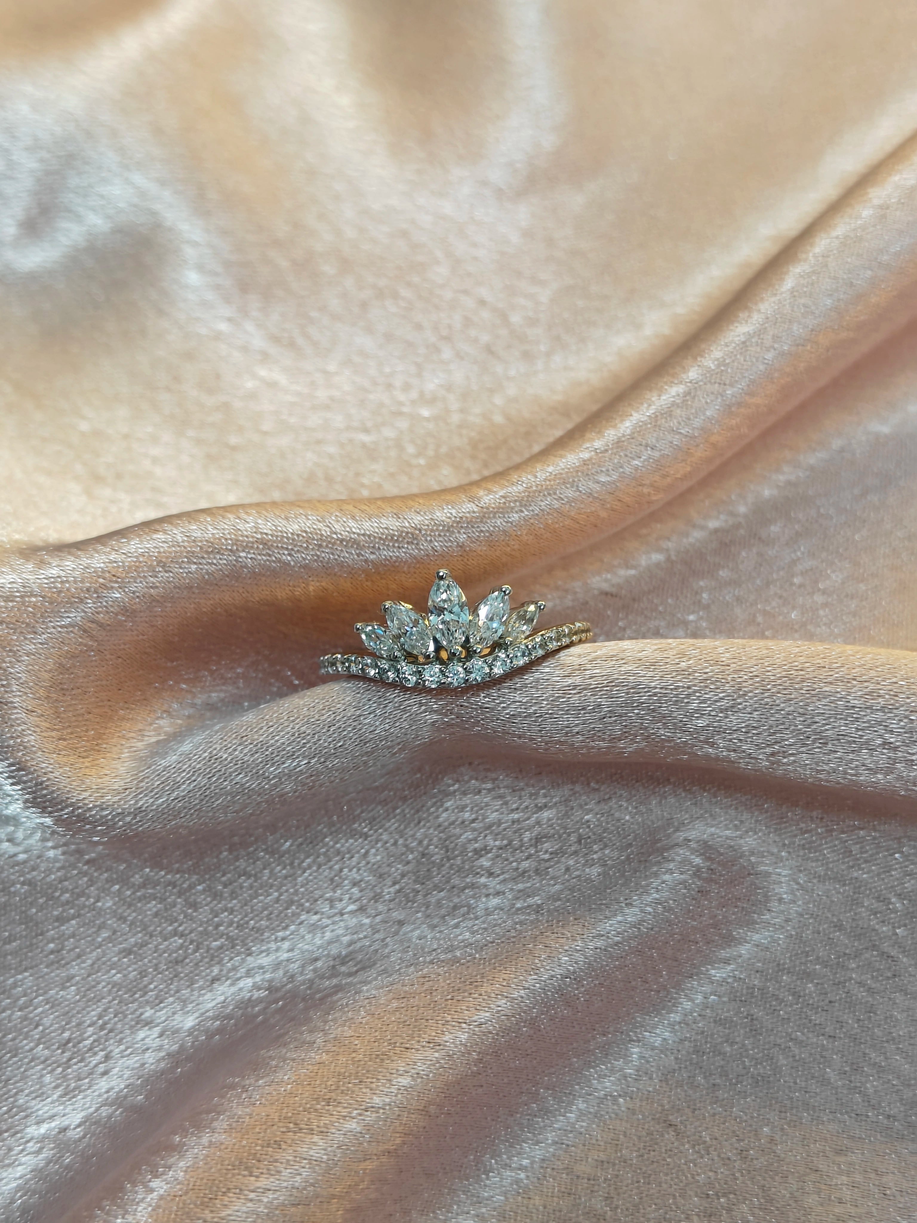 Diamond ring on a beige satin fabric