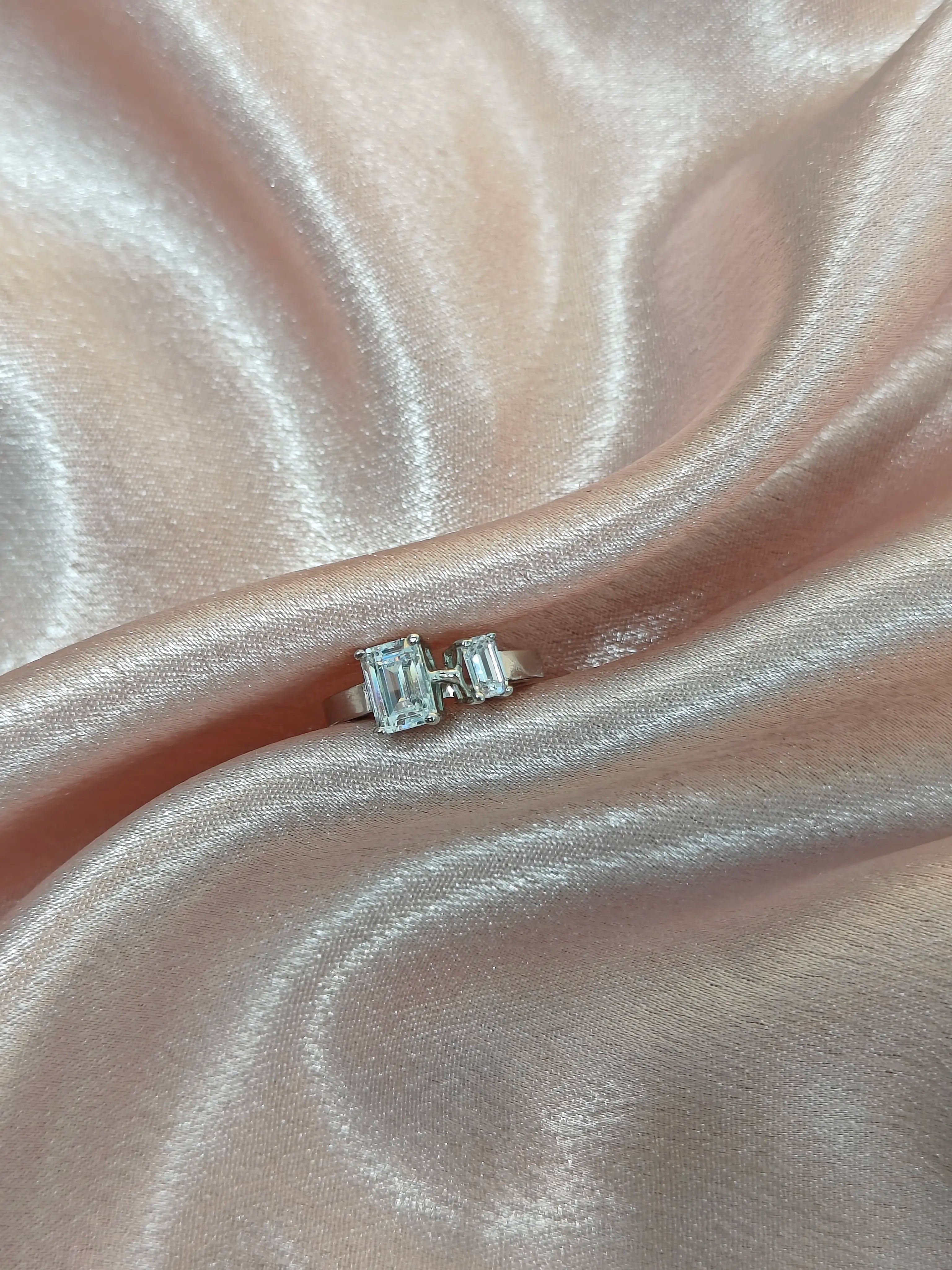 Diamond ring on a pink satin surface