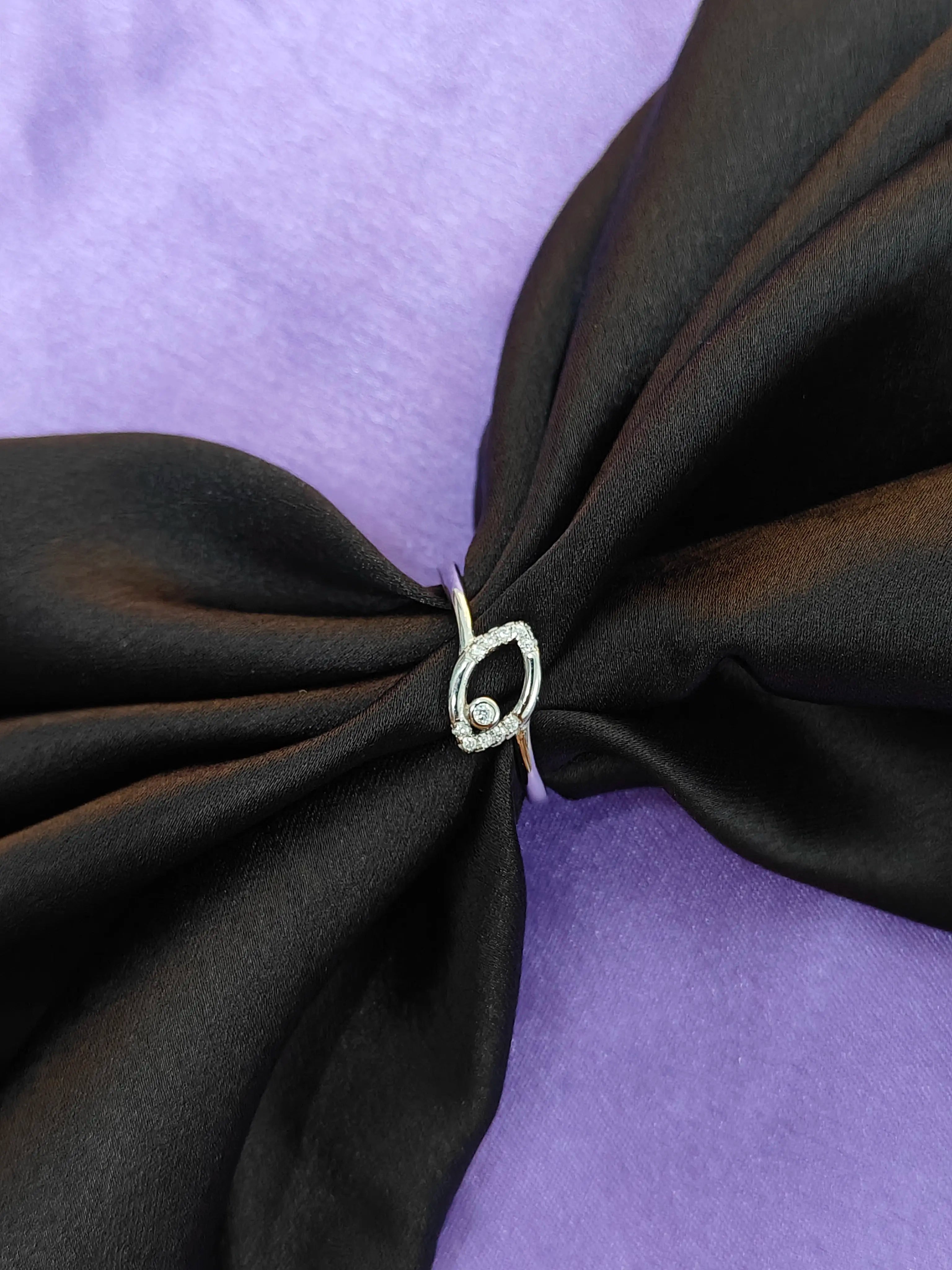 Black fabric with a knot on a purple background