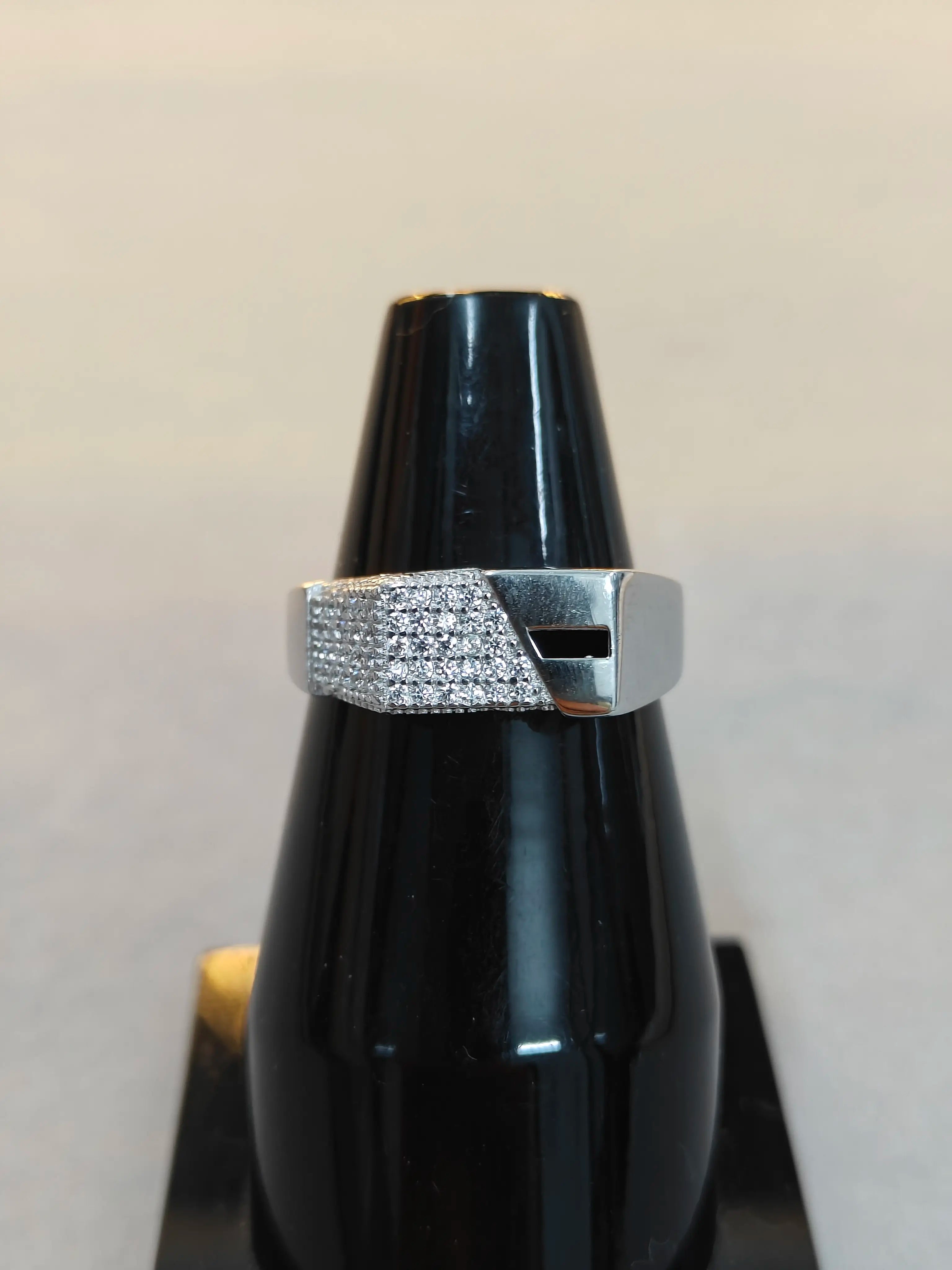 Silver ring with black background