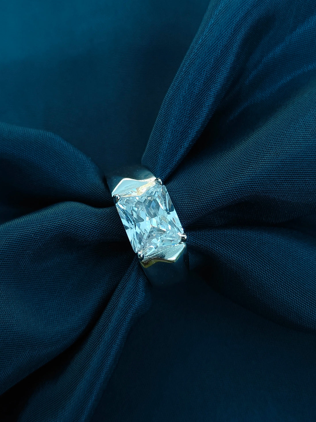 Diamond on a blue fabric background
