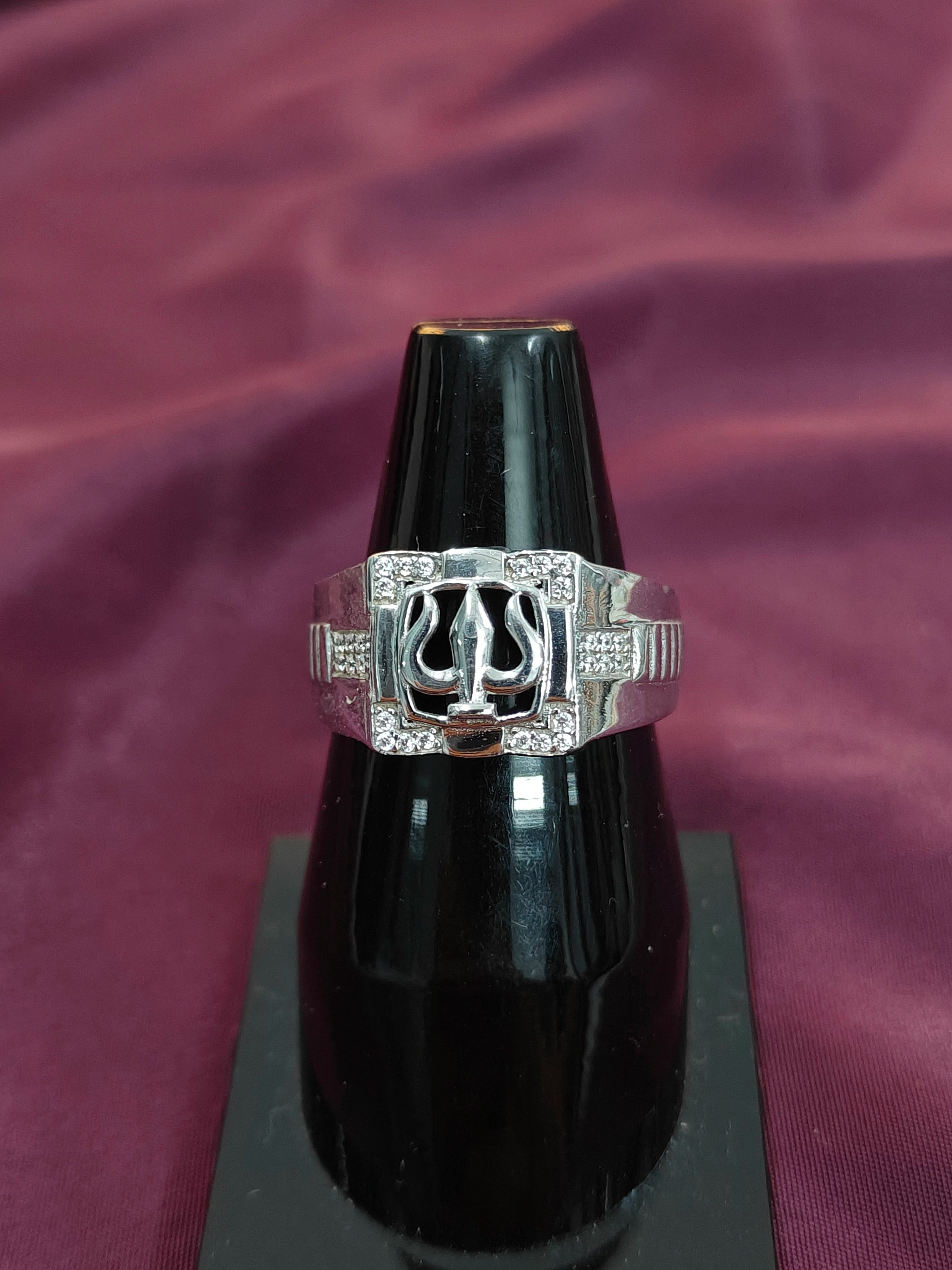 Silver ring with a black background