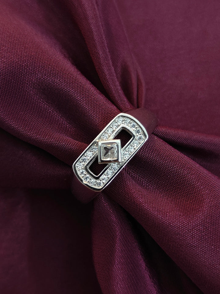 Decorative brooch on a burgundy fabric background