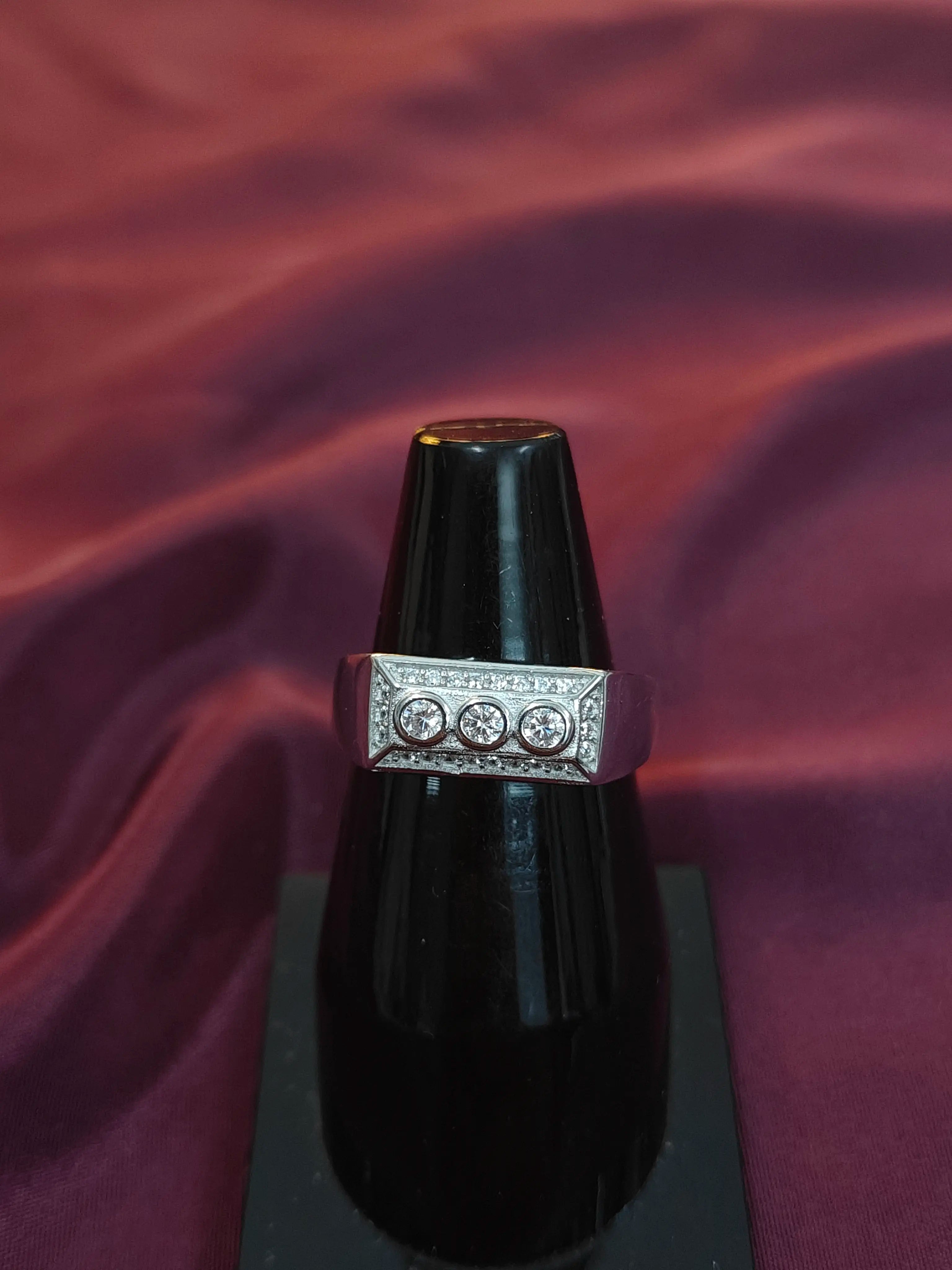 Ring with a diamond band on a dark background