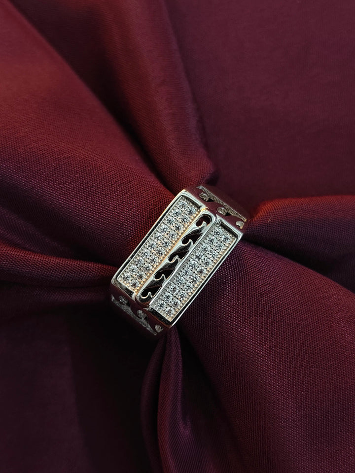 Gold and diamond bracelet on a burgundy fabric background
