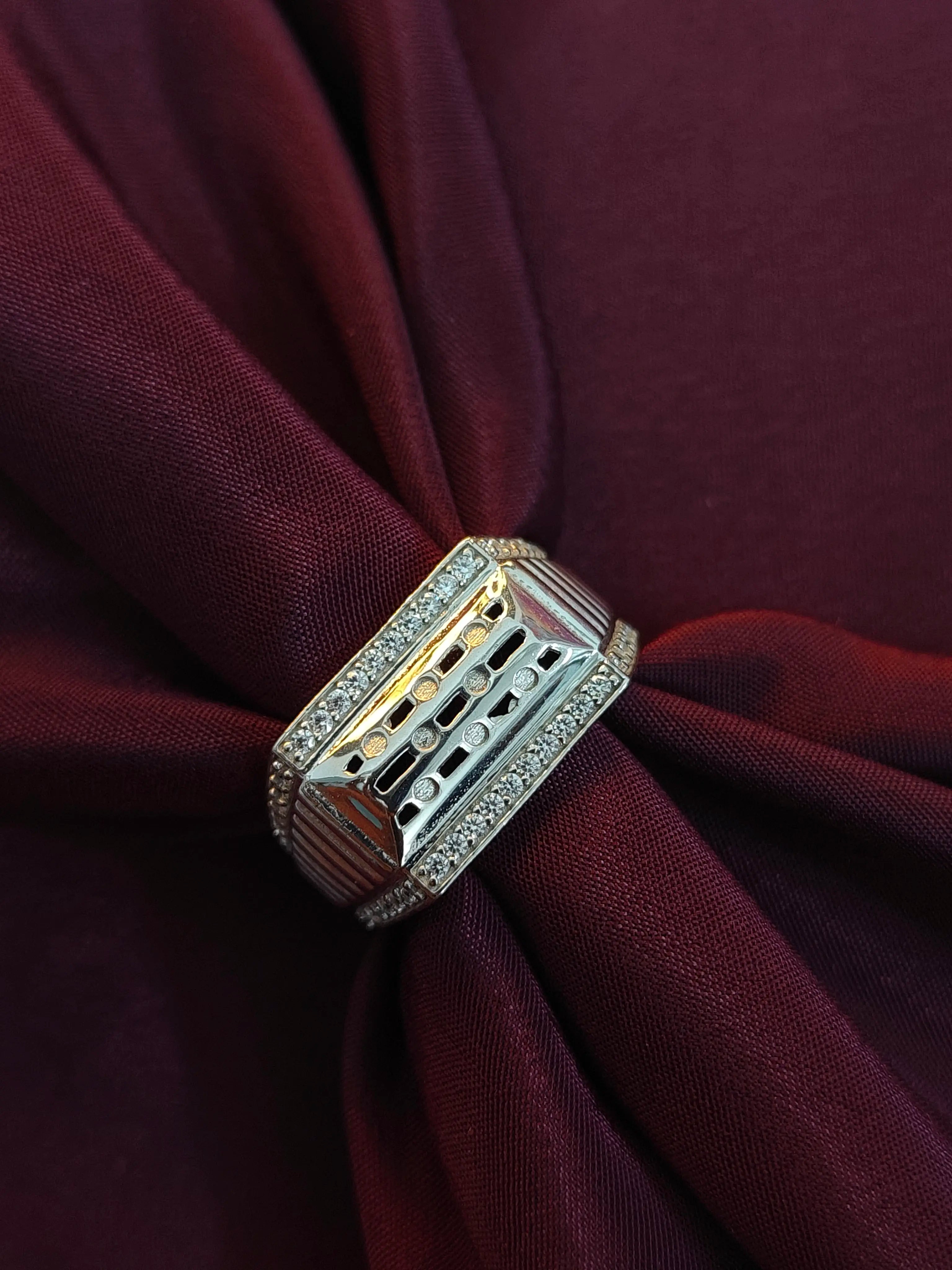 Decorative brooch on a burgundy fabric background