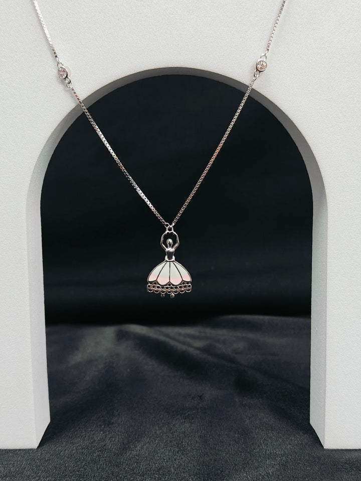 Silver necklace with a pendant on a dark background