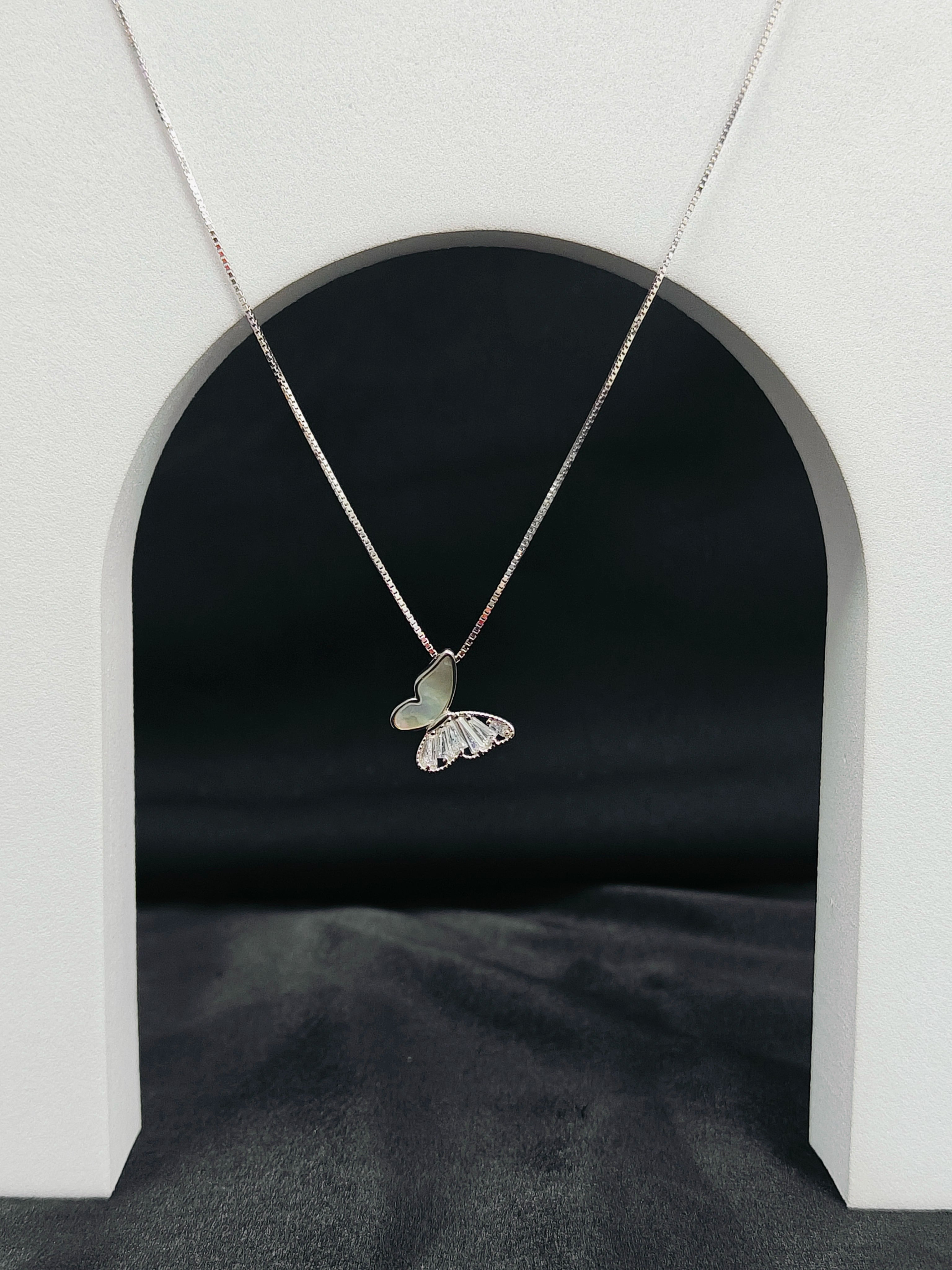 Butterfly necklace on a white background