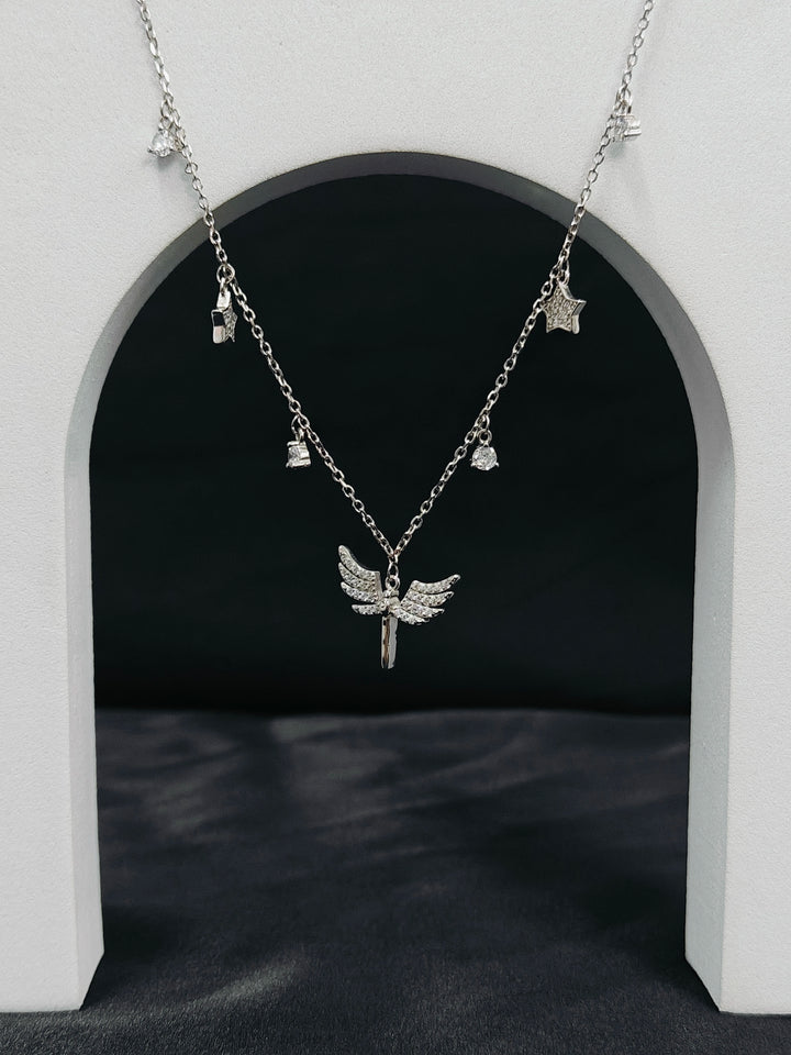 Silver necklace with angel wing pendant on a dark background