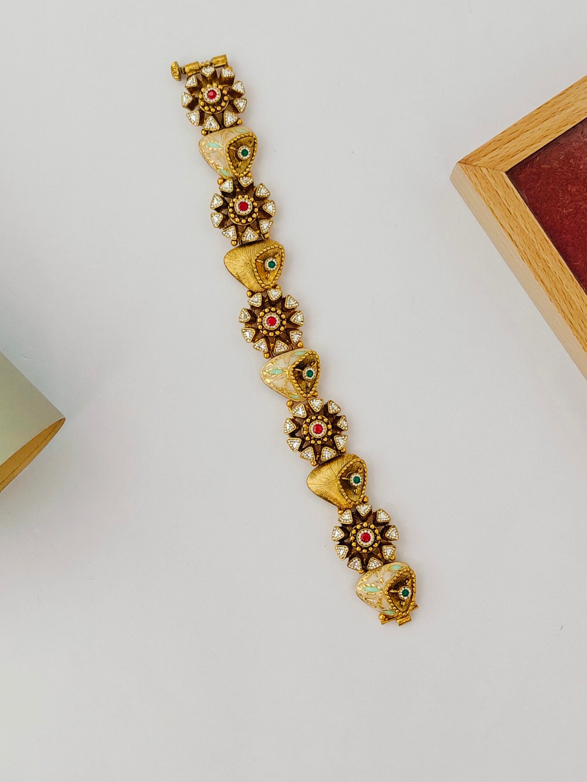 Decorative bracelet with floral designs on a light gray background