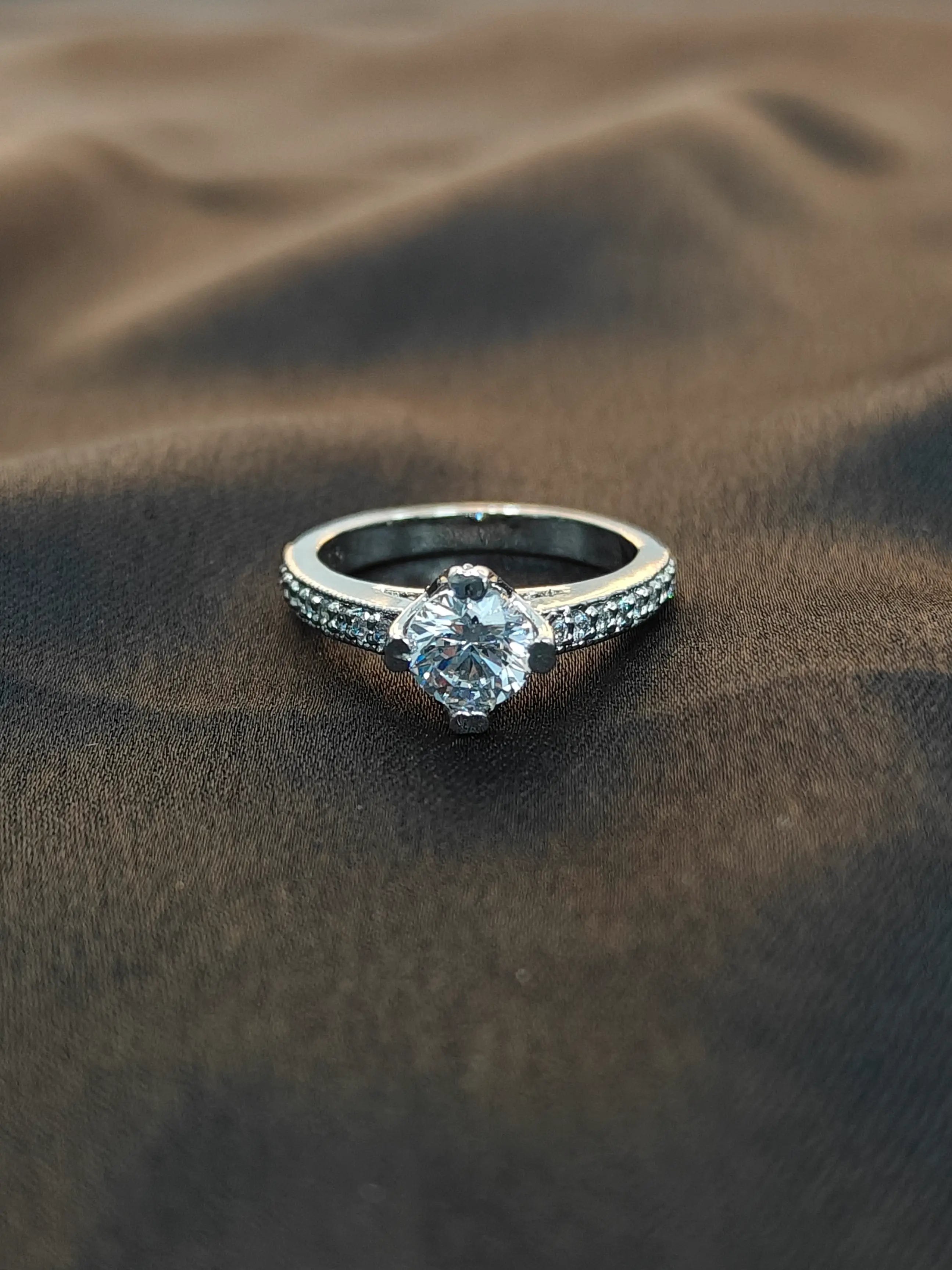 Diamond ring on sand