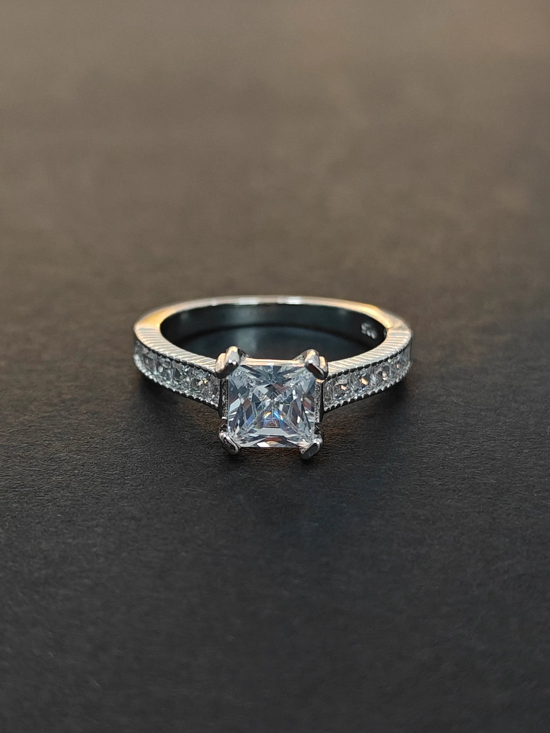 Diamond ring with a dark background