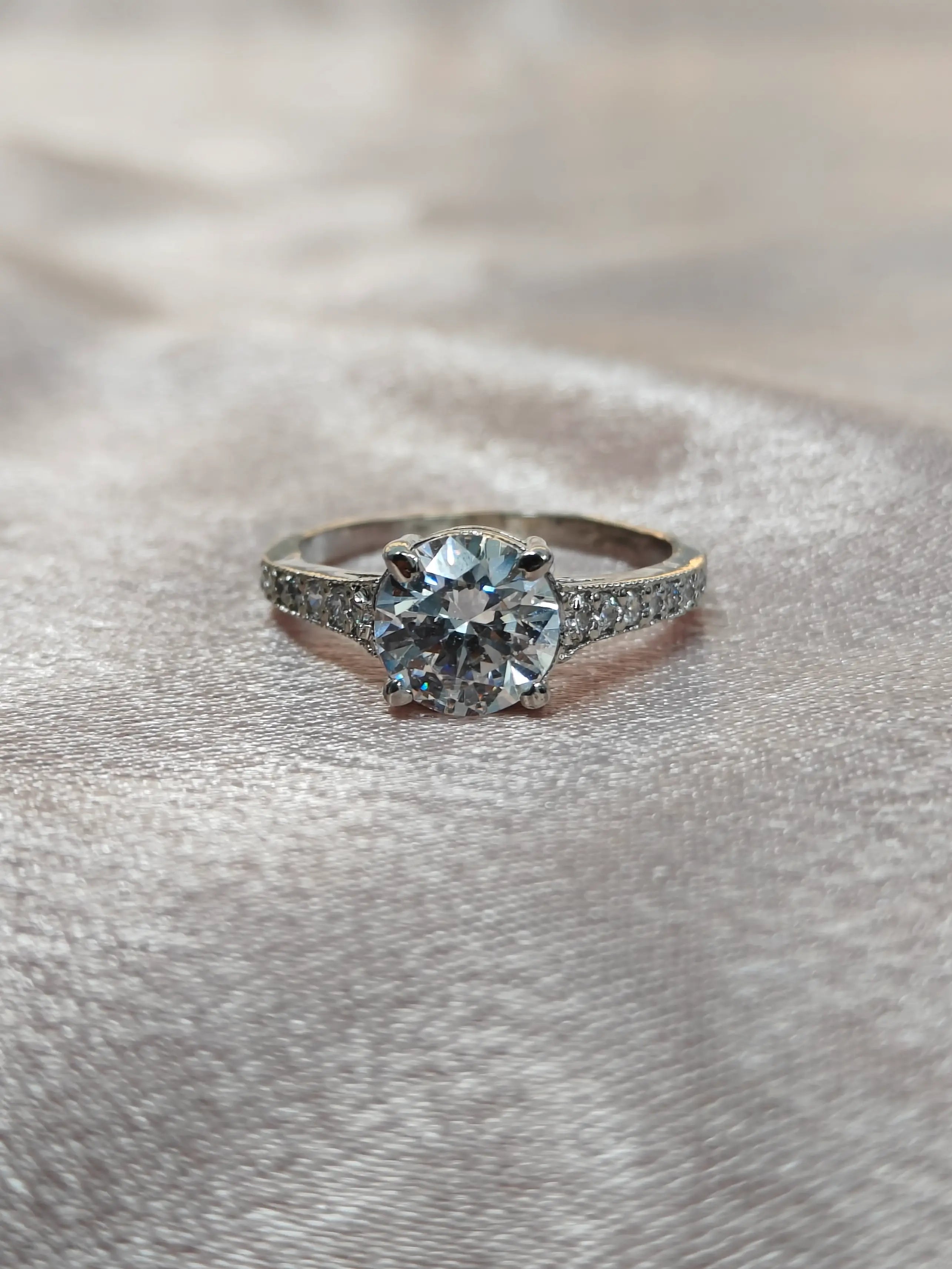 Diamond ring on a textured gray surface
