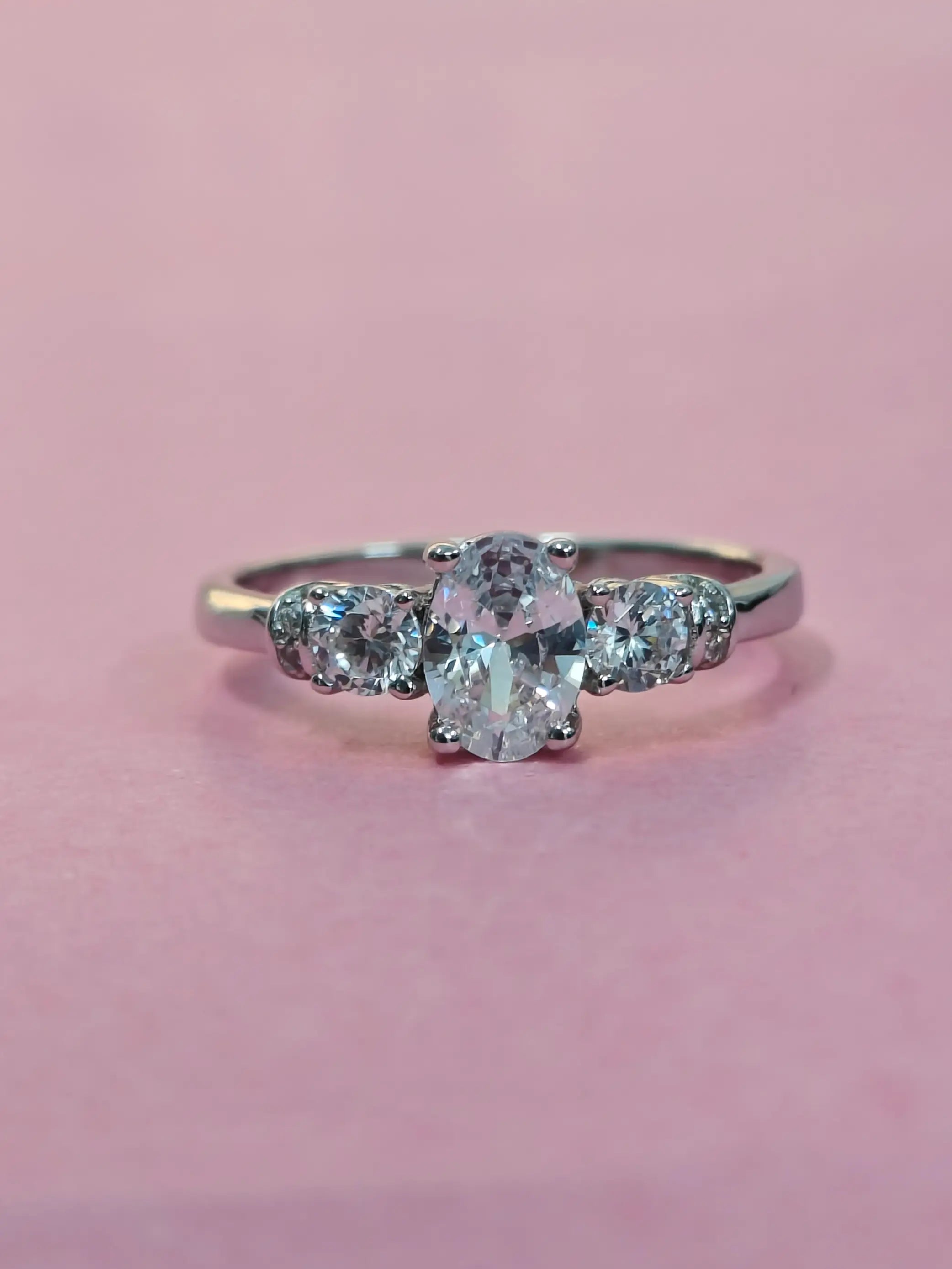 Diamond ring with a pink background
