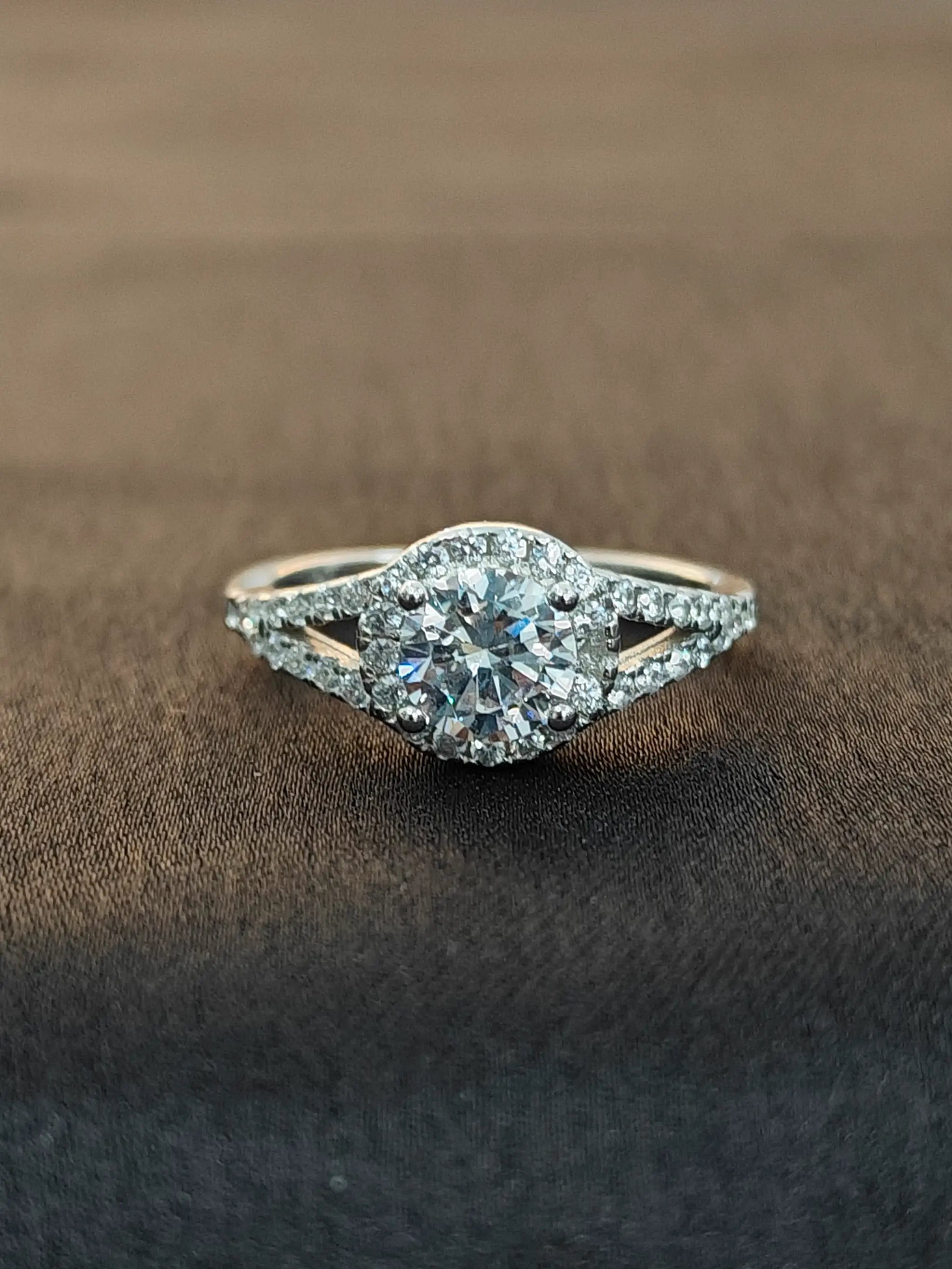 Diamond ring on a brown fabric background