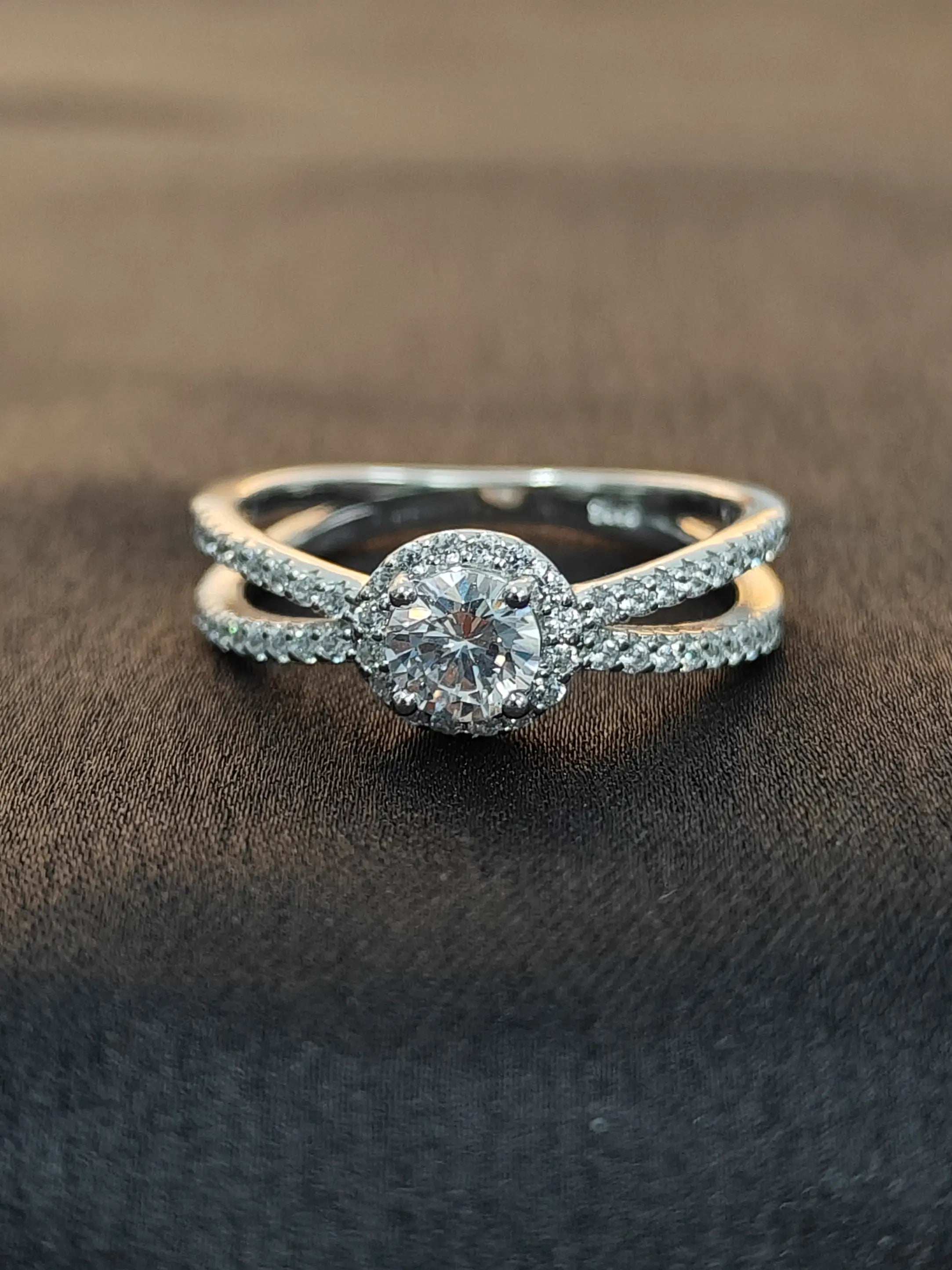 Diamond ring with a brown background