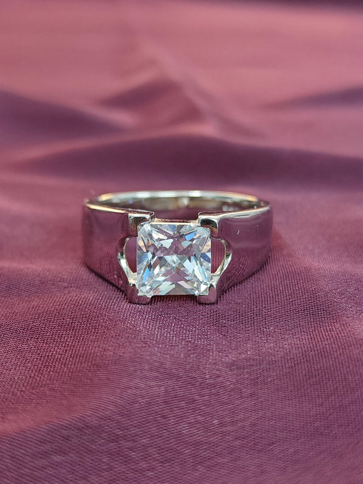 Diamond ring on a purple fabric background