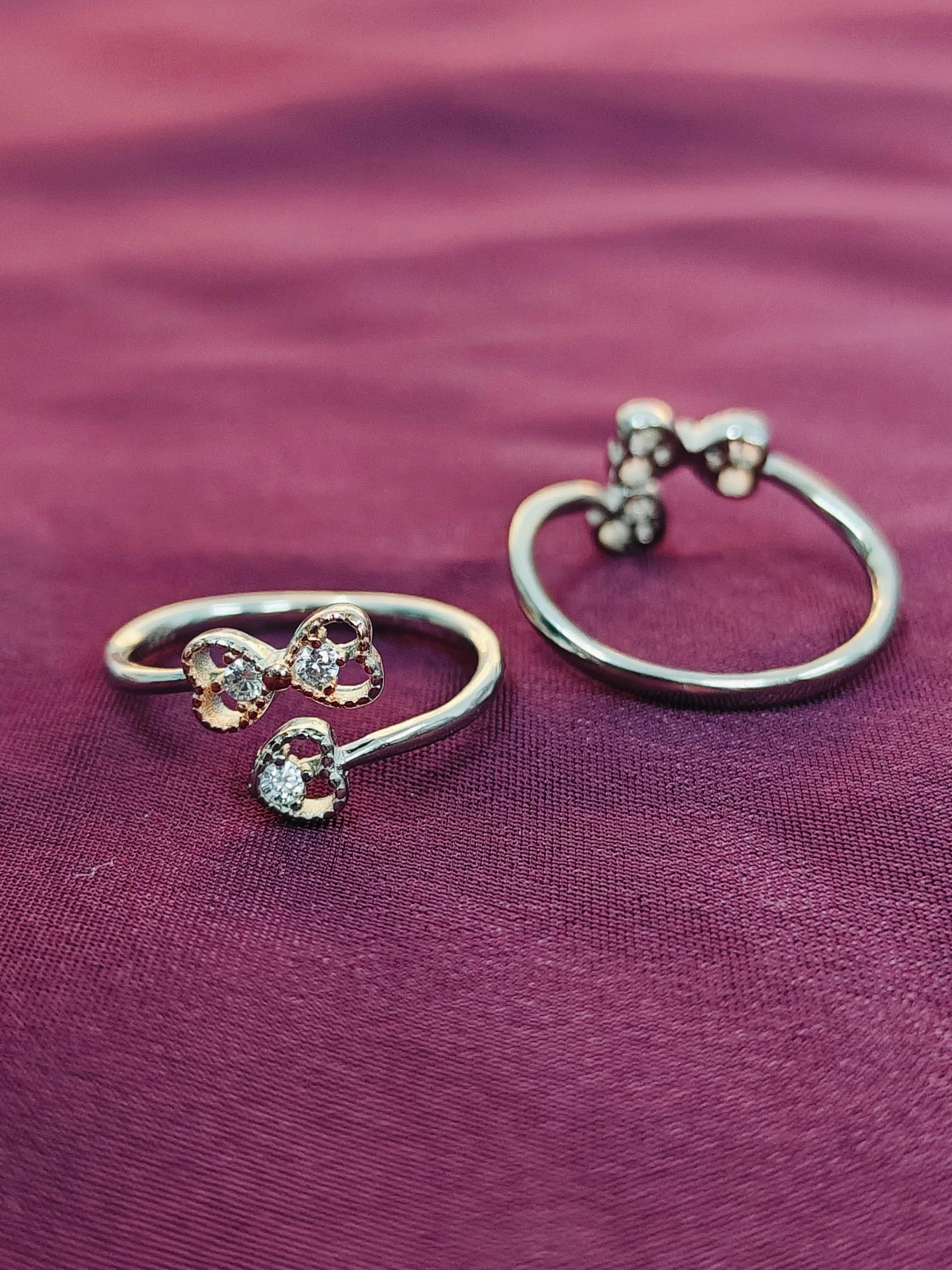 Two rings on a purple fabric background